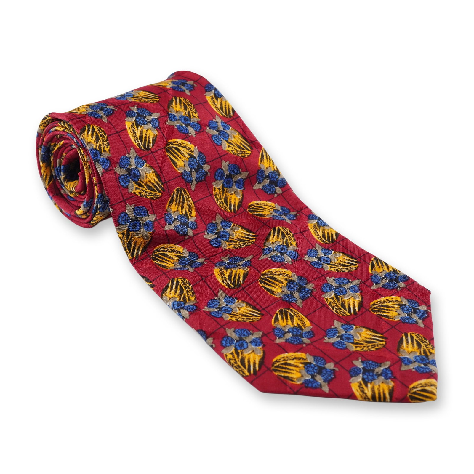 Ungaro Paris Red Silk Necktie with Abstract Floral and Geometric Pattern: A modern Ungaro Paris 100% silk necktie. The tie features a vibrant red ground patterned with a repeating design of abstract blue floral clusters and yellow and black striped shapes, all arranged with