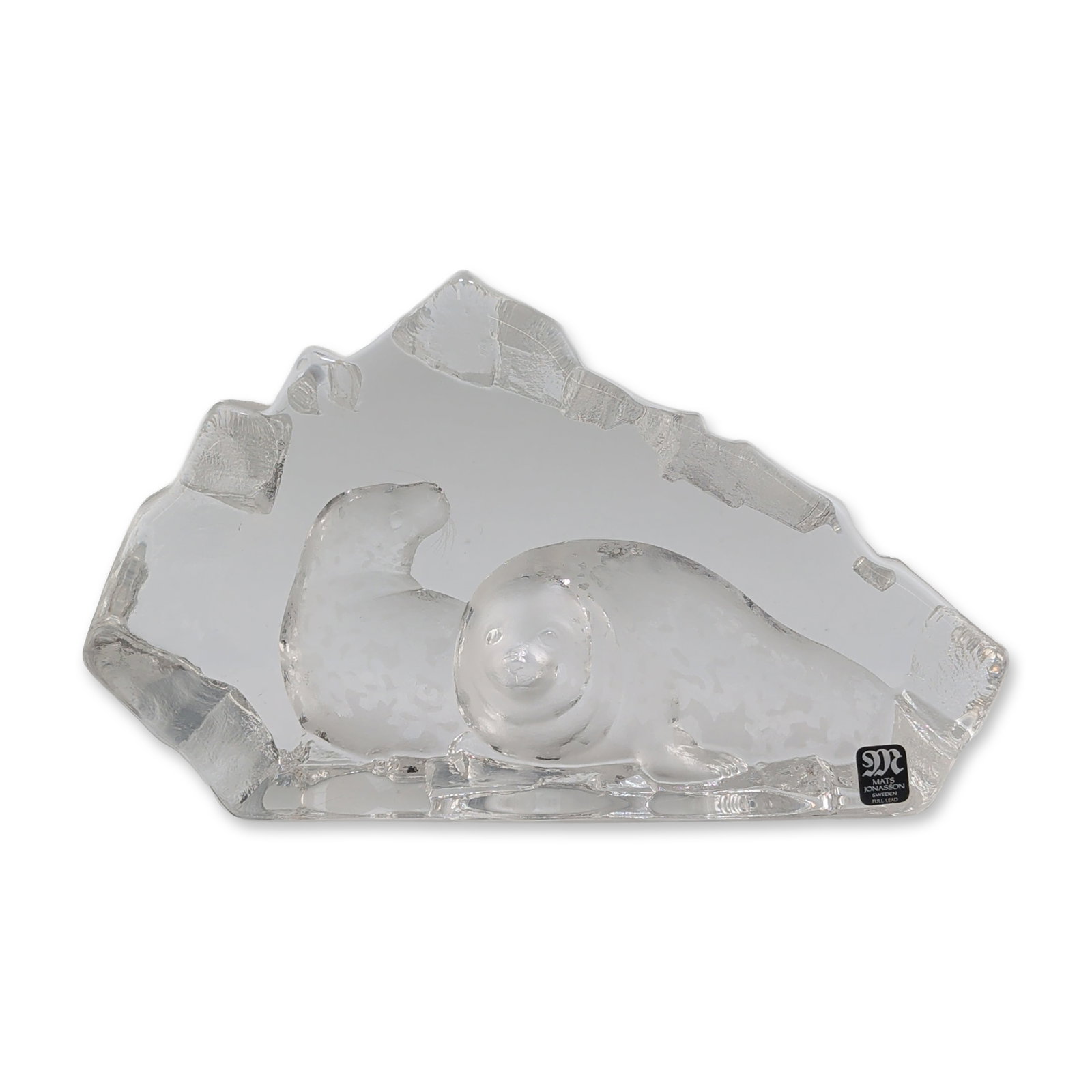 Mats Jonasson Sweden Seals Crystal Sculpture: Mats Jonasson, Maleras, Sweden. Art glass sculpture in full lead crystal, featuring an intaglio-carved pair of seals. The clear crystal block is rough-hewn and textured to resemble a natural ice forma