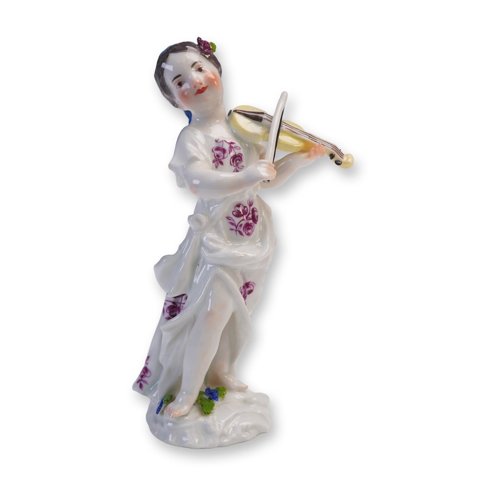 Porcelain Figurine, Girl Playing Violin: Charming porcelain figurine depicting a young girl in mid-performance, delicately playing a yellow violin. She is adorned in a flowing white dress accented with deep purple floral motifs, with her bar