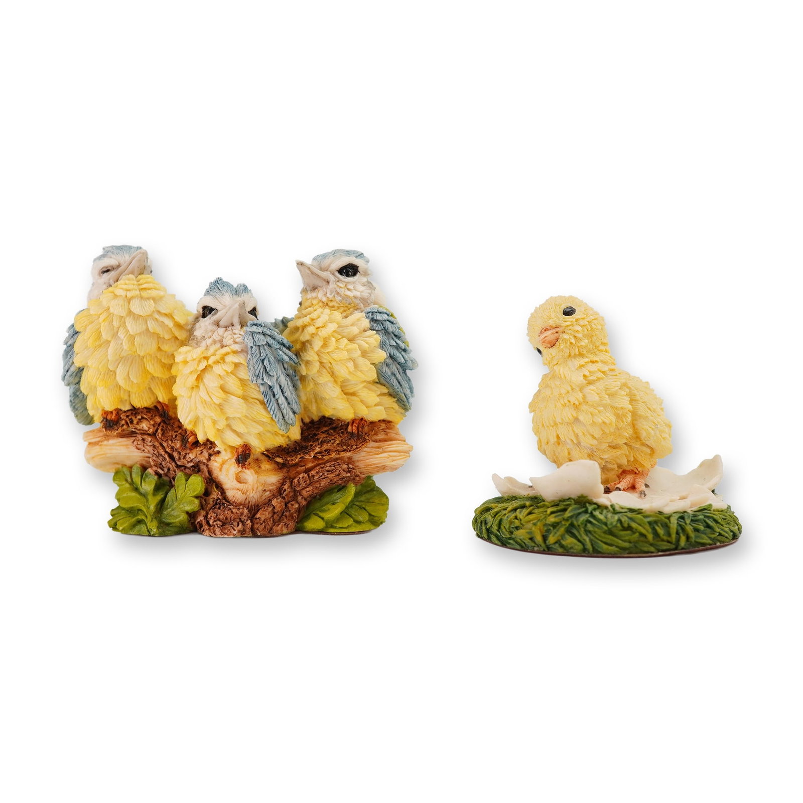 2pc Country Artists Resin Bird Figurines: Two Country Artists resin figurines. The first figurine depicts three fledglings huddled on a textured branch, with the reverse marked Langford and CA copyright 1992. The second figurine features a