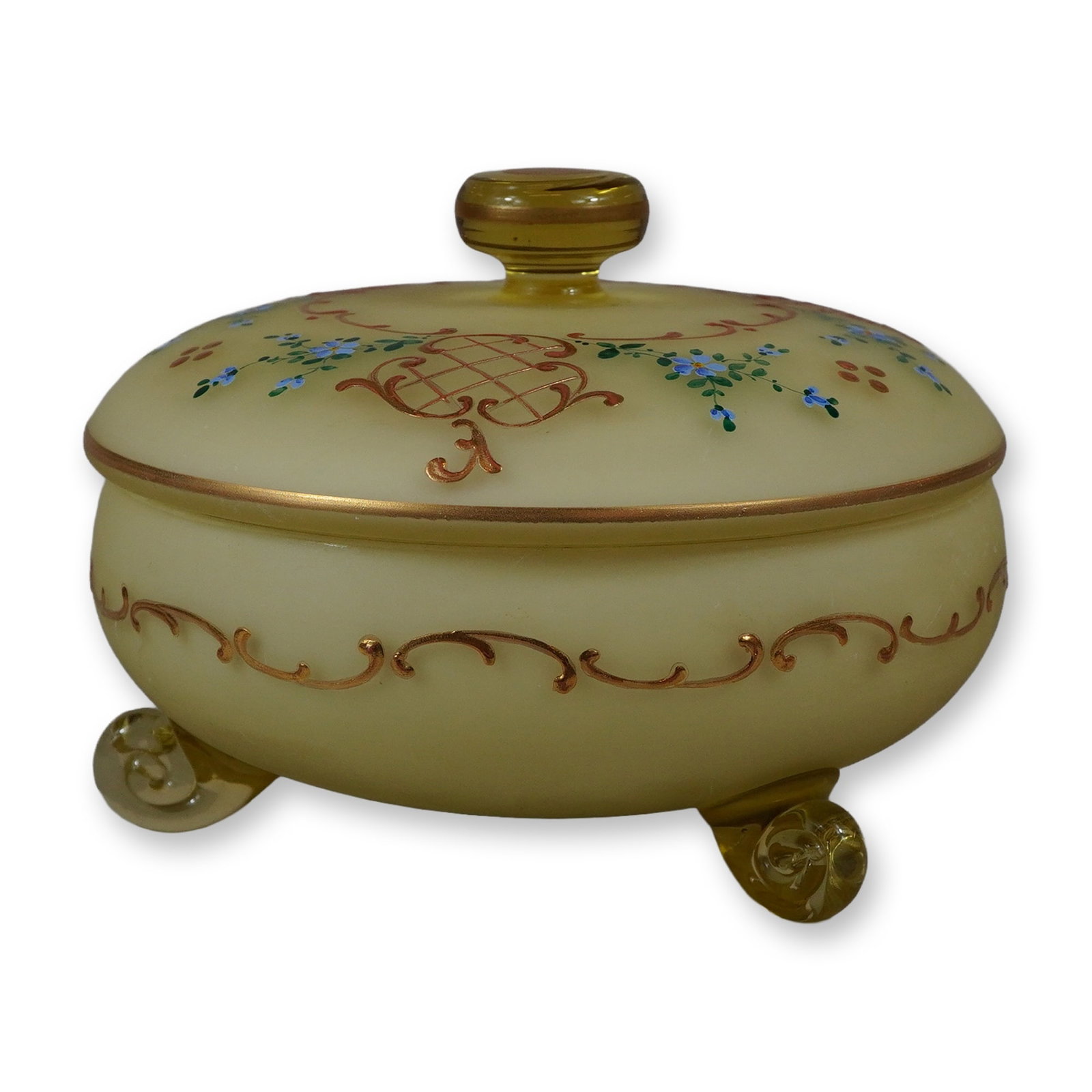 Vintage German Custard Cased Satin Glass Lidded Dish with Hand-Painted Floral Designs: This vintage custard cased glass lidded dish, likely intended as a powder or trinket jar, is constructed from pale yellow satin glass cased over an opaque white interior. The rounded body is