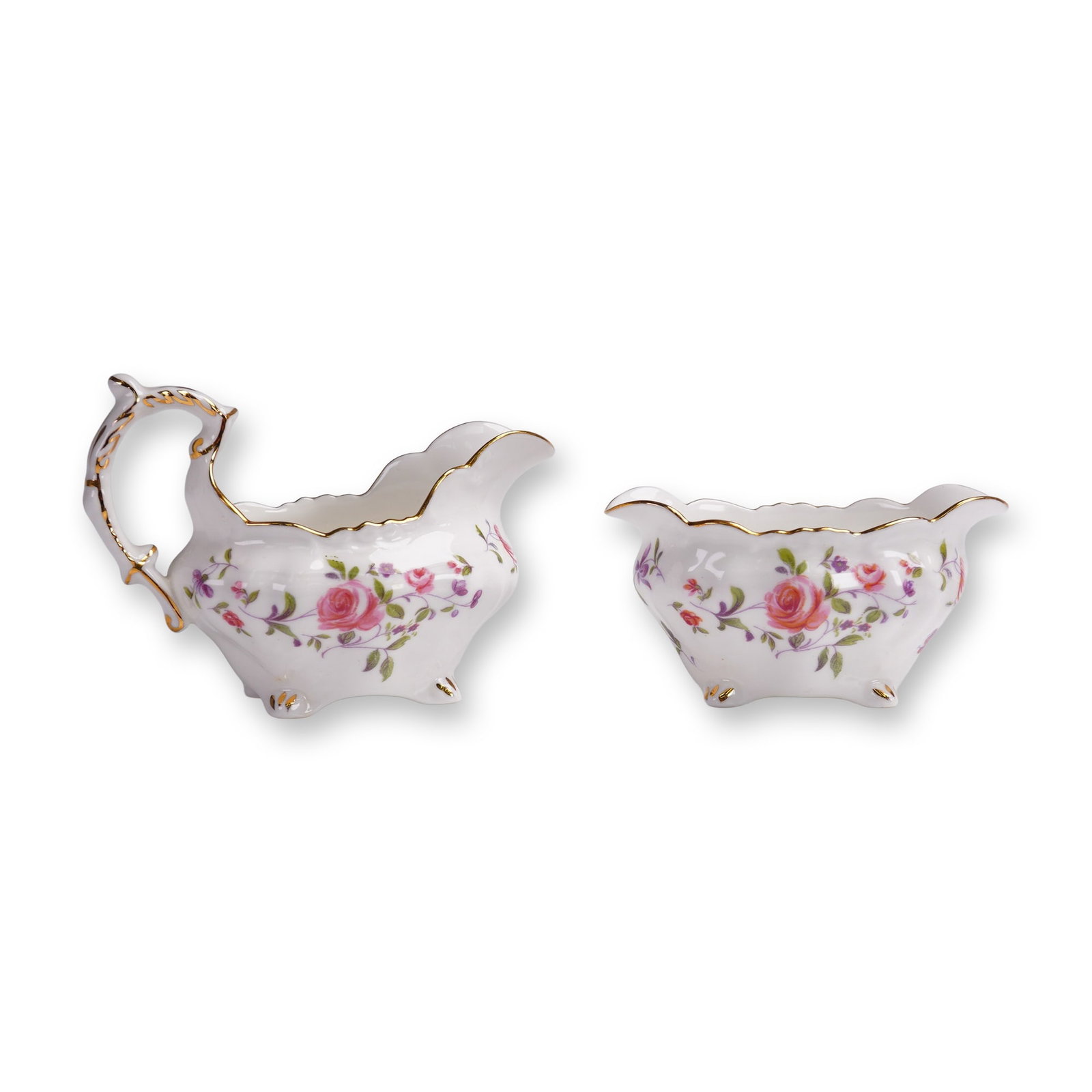 2pc Hammersley Creamer and Sugar Bowl, Floral Pattern: Offered here is a beautiful and finely crafted Hammersley bone china creamer and sugar bowl set, made in England. The pieces feature an elegant floral chintz design in vibrant shades of pink, purple,