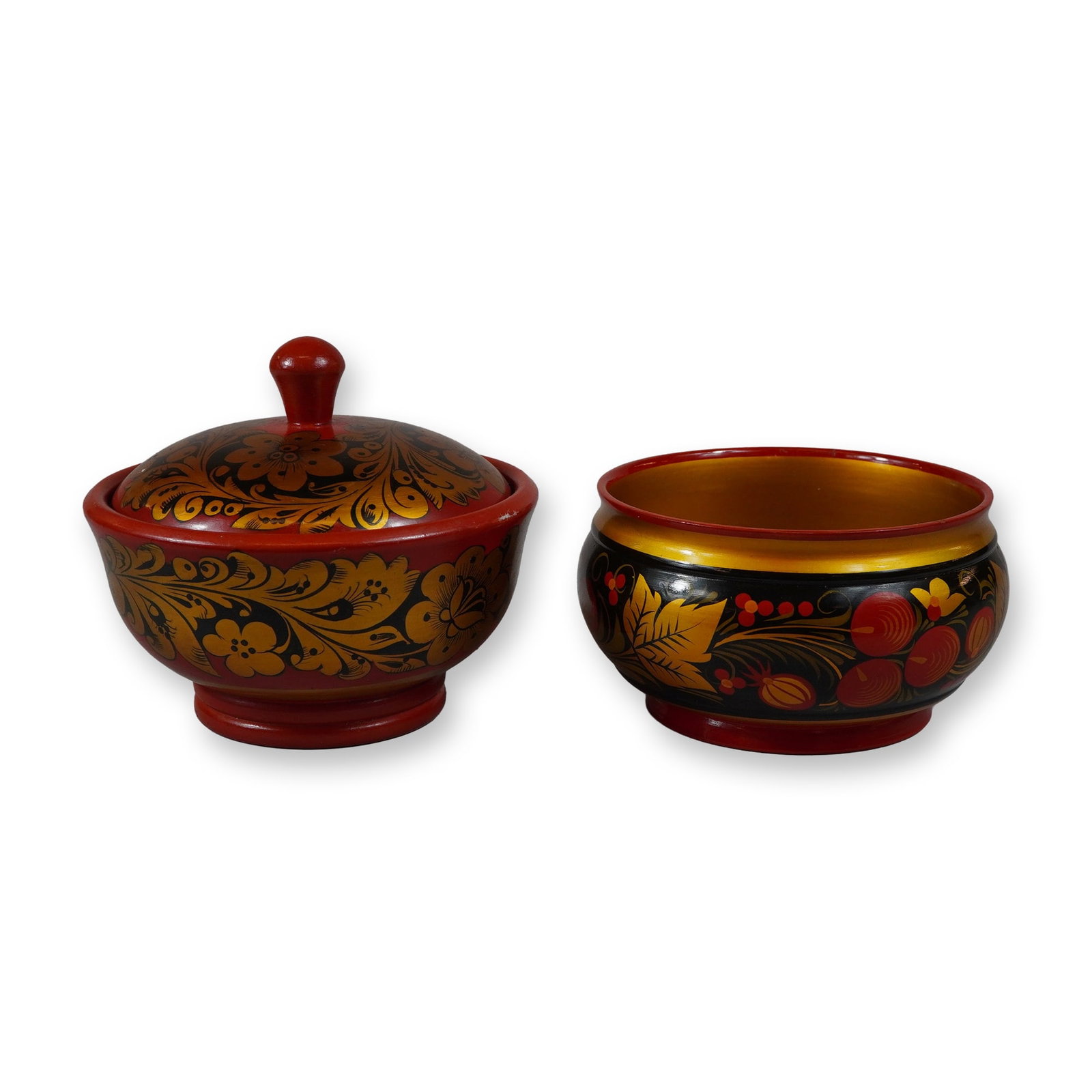 2pc Russian Khokhloma Hand Painted Lacquerware Bowls: This lot features two pieces of Russian lacquerware, comprising one lidded bowl and one open serving bowl. These hand-painted wooden vessels were manufactured in the USSR during the late Soviet