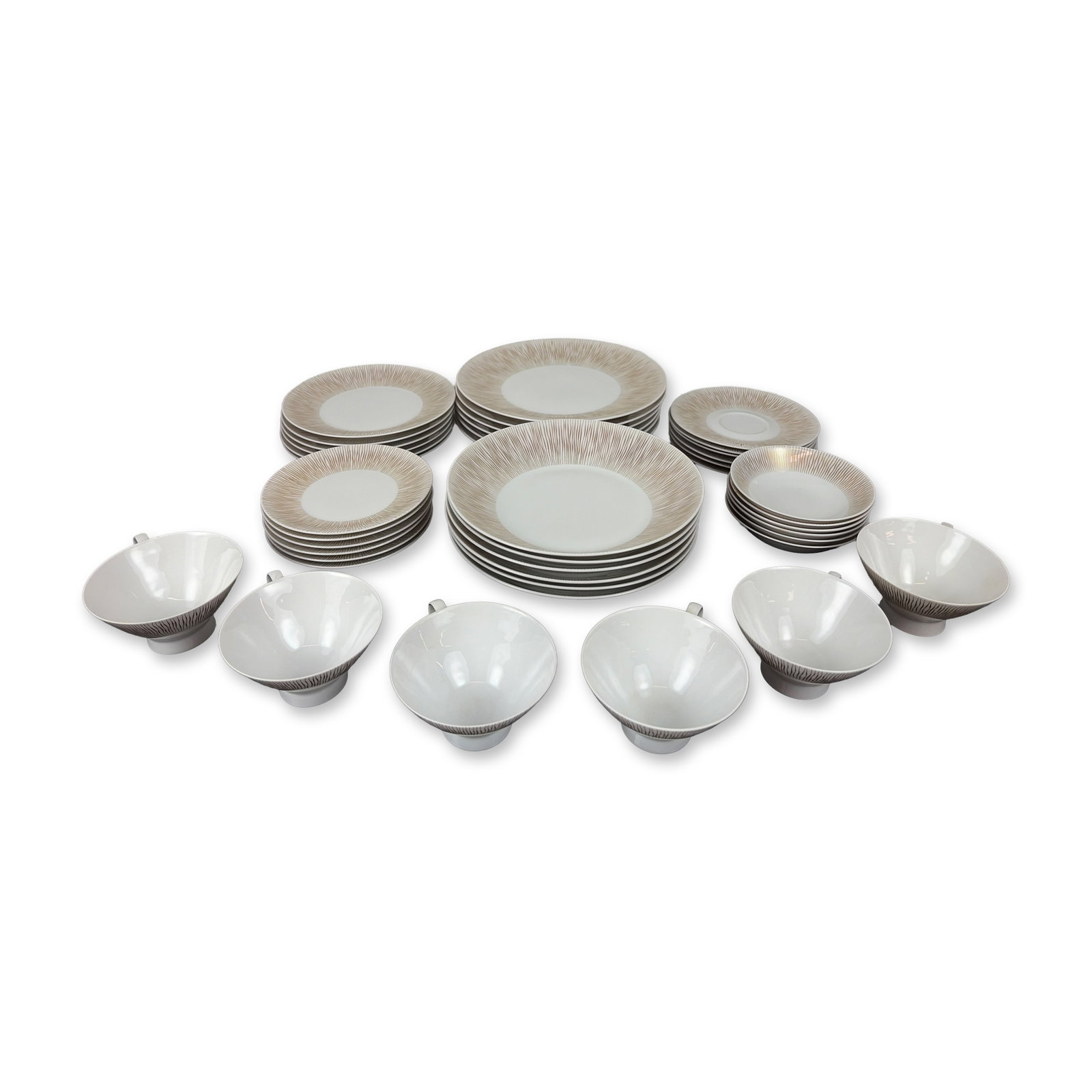 42-Piece Rosenthal Goldstrahlen Pattern Porcelain Dinnerware, Service for Six: Forty-two-piece dinner service in fine porcelain featuring the Goldstrahlen pattern. Decoration consists of fine radiating tan and gold lines on a white ground. Service includes six dinner plates 10",