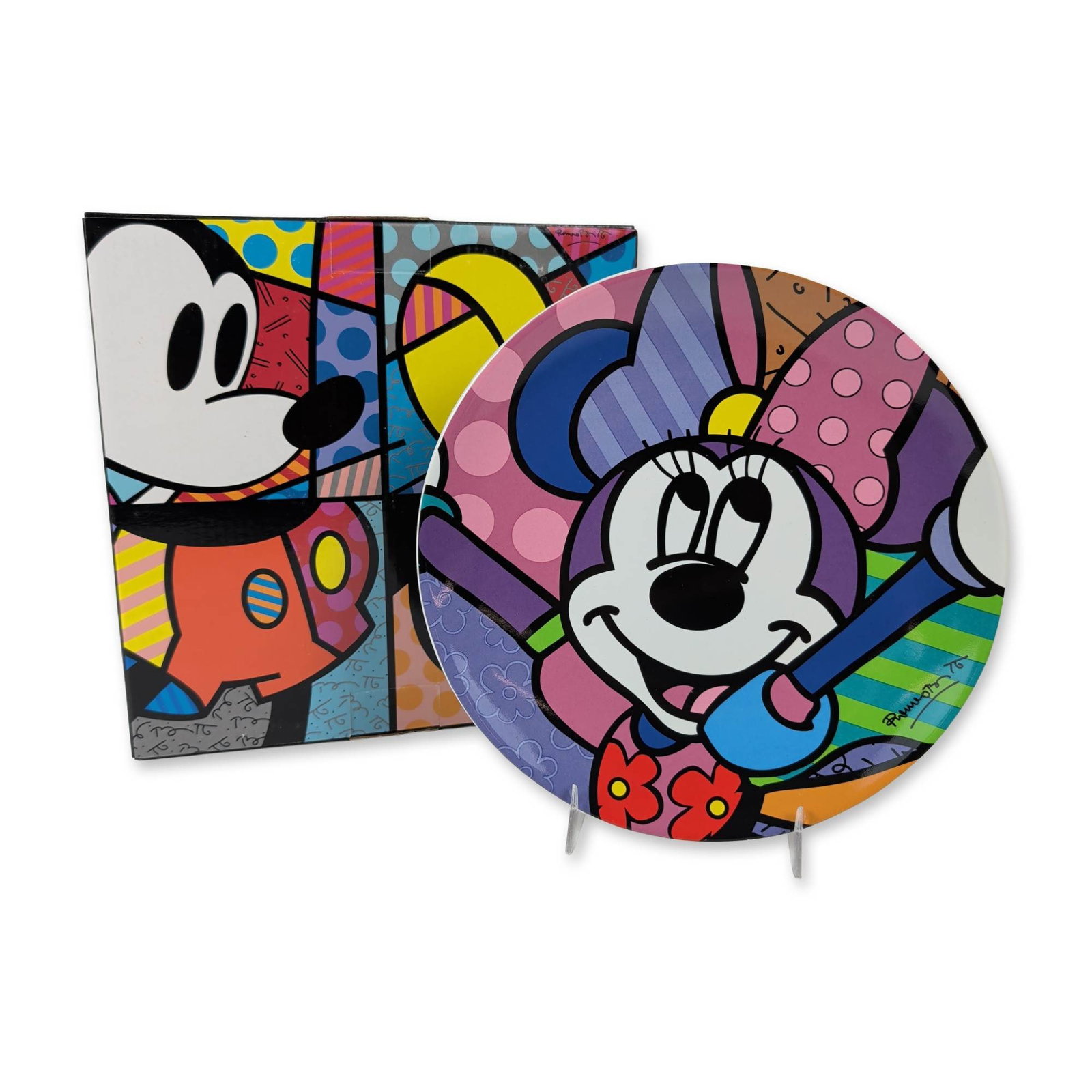 Disney by Britto Minnie Mouse Ceramic Plate: Romero Britto for Disney. Round decorative ceramic plate in a glazed white body, featuring a vibrant pop-art depiction of Minnie Mouse. The design utilizes the artist signature graphic style with