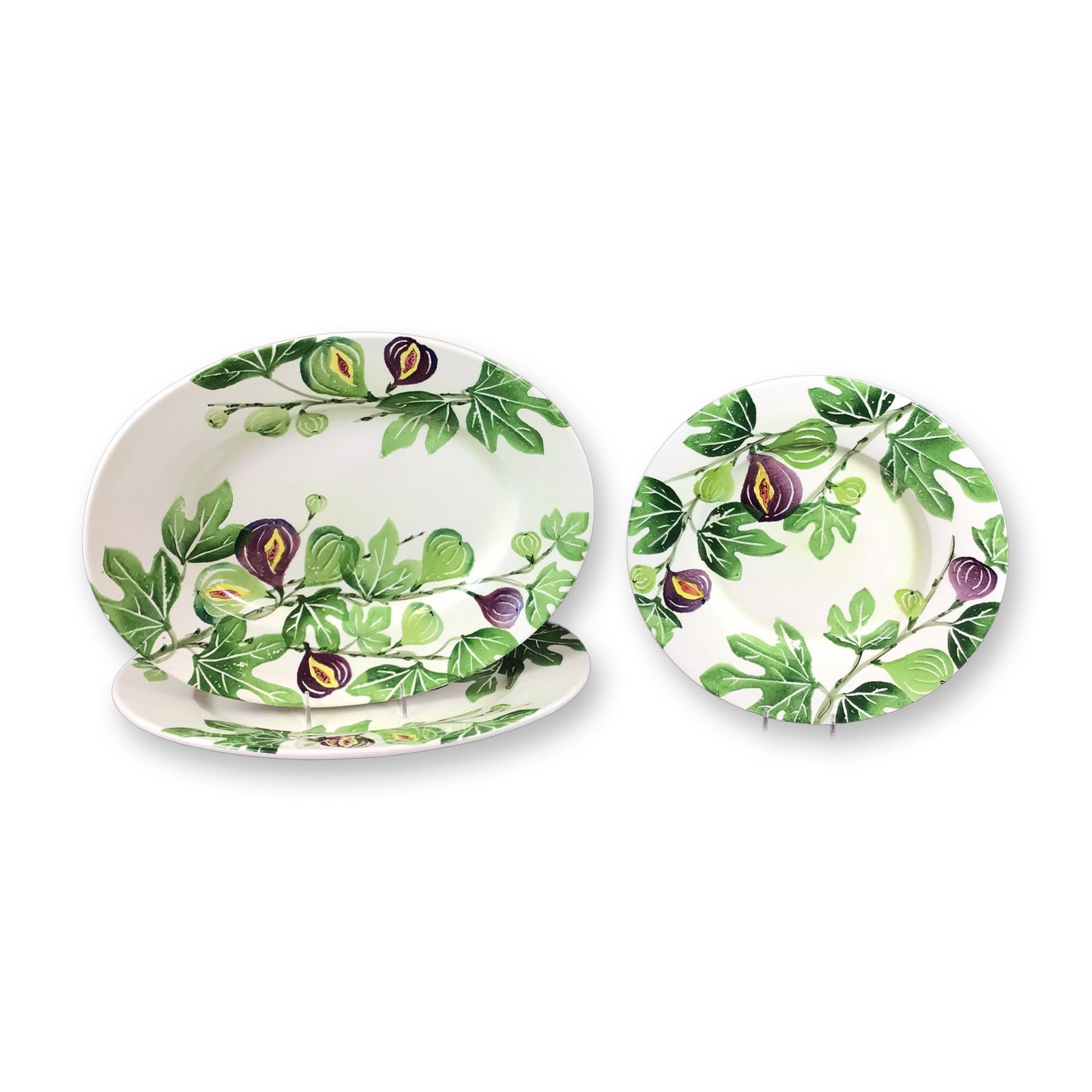 3pc Neiman Marcus Italian Ceramic Fig Pattern Platters and Plate: This lot features three ceramic serving pieces manufactured in Italy for the luxury retailer Neiman Marcus. The set includes two oval serving platters and one round plate, all constructed from glazed