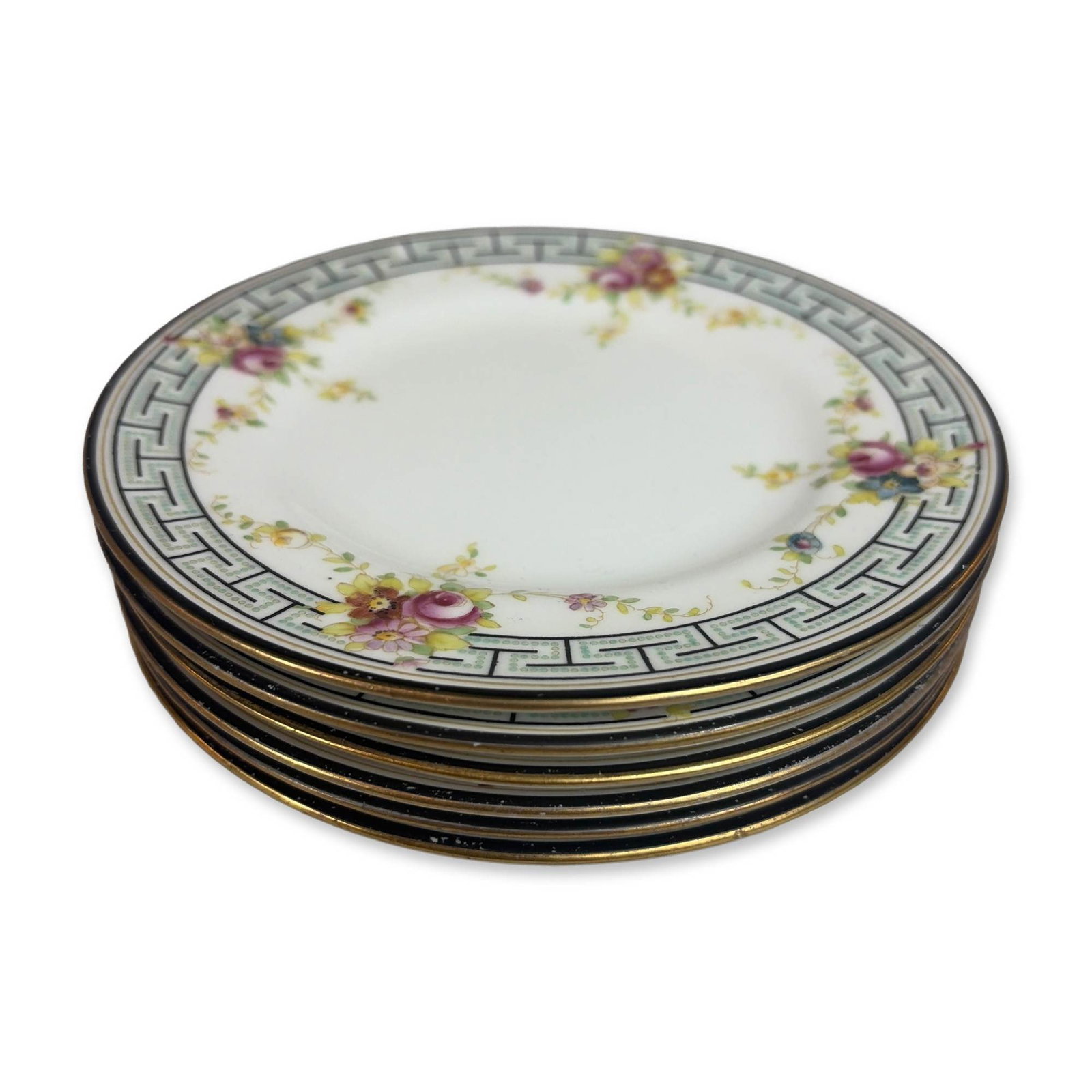 6pc Royal Doulton Gump Co. Porcelain Plates: Set of six porcelain plates produced for S. & G. Gump Co. of San Francisco. The collection features hand-painted polychrome floral sprays on a white ground, framed by a teal and black Greek key