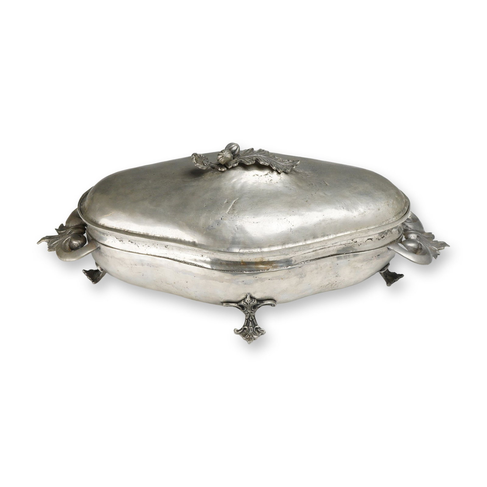 Portuguese Rococo Style Pewter Covered Vegetable Dish, 20th Century: Portuguese pewter covered vegetable dish in the Rococo style, 20th century. The vessel features an elongated, lobed quatrefoil form and stands on four cast, foliate-decorated scroll feet. The conformi