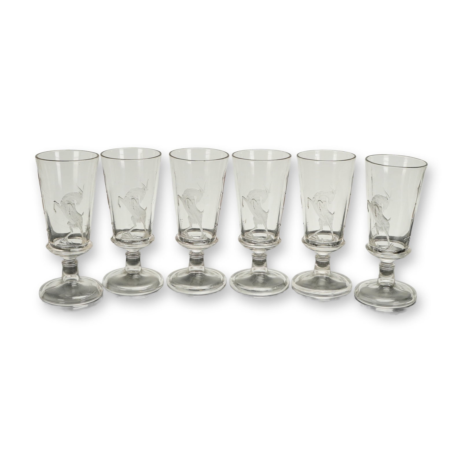 A Collection of Six Pabst Blue Ribbon Bock Beer Stemmed Goblets: A collection of 6pc Pabst Blue Ribbon Bock Beer short stemmed goblets. Each item is constructed of clear glass. The form features a flared, slightly tapered bowl supported by a short stem incorporatin