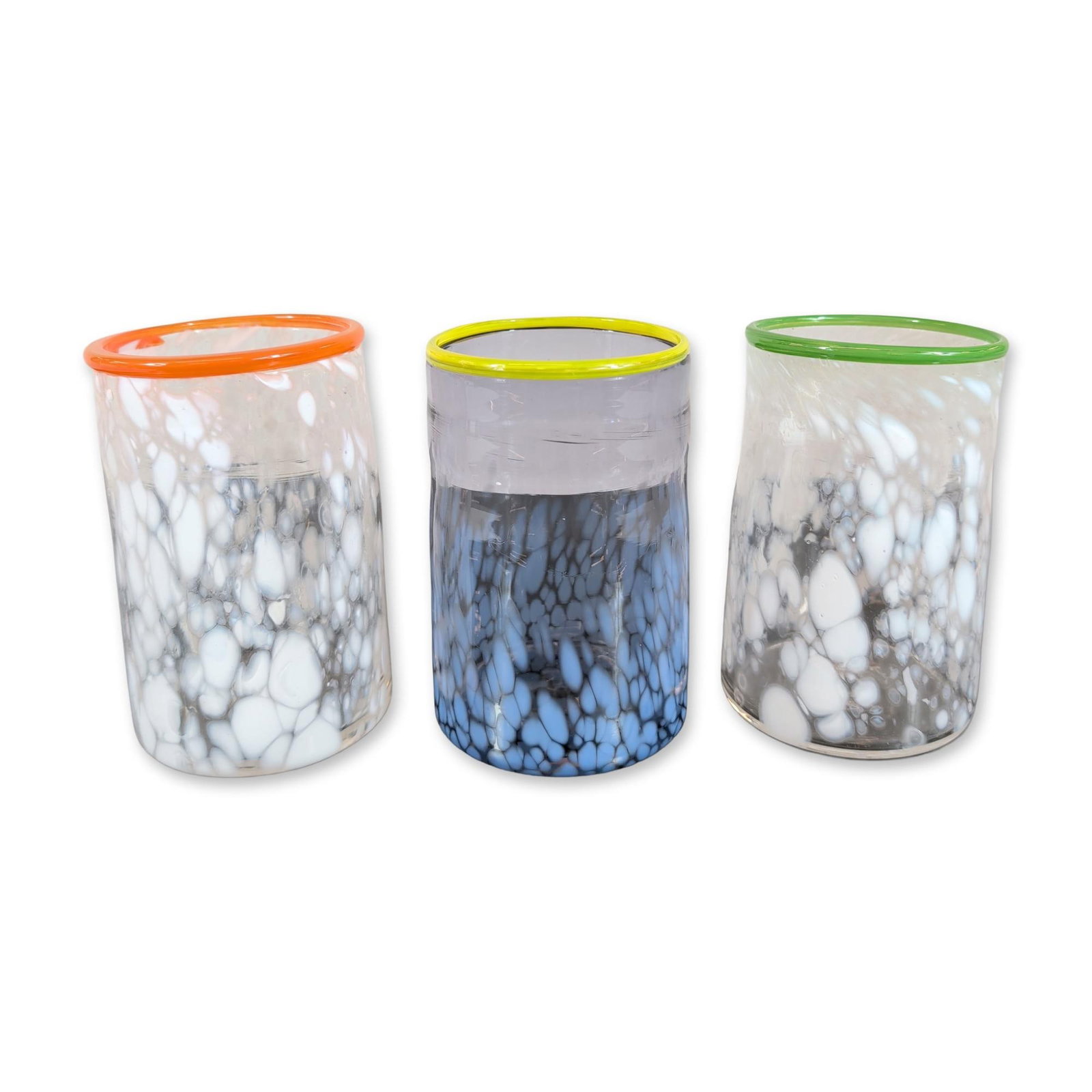3pc Wheaton Arts Studio Glass Tumblers: Trio of hand-blown studio glass tumblers, dated 2008, featuring thick-walled construction with internal mottled frit patterning in blue and white palettes. Each vessel is finished with a thin, brightl