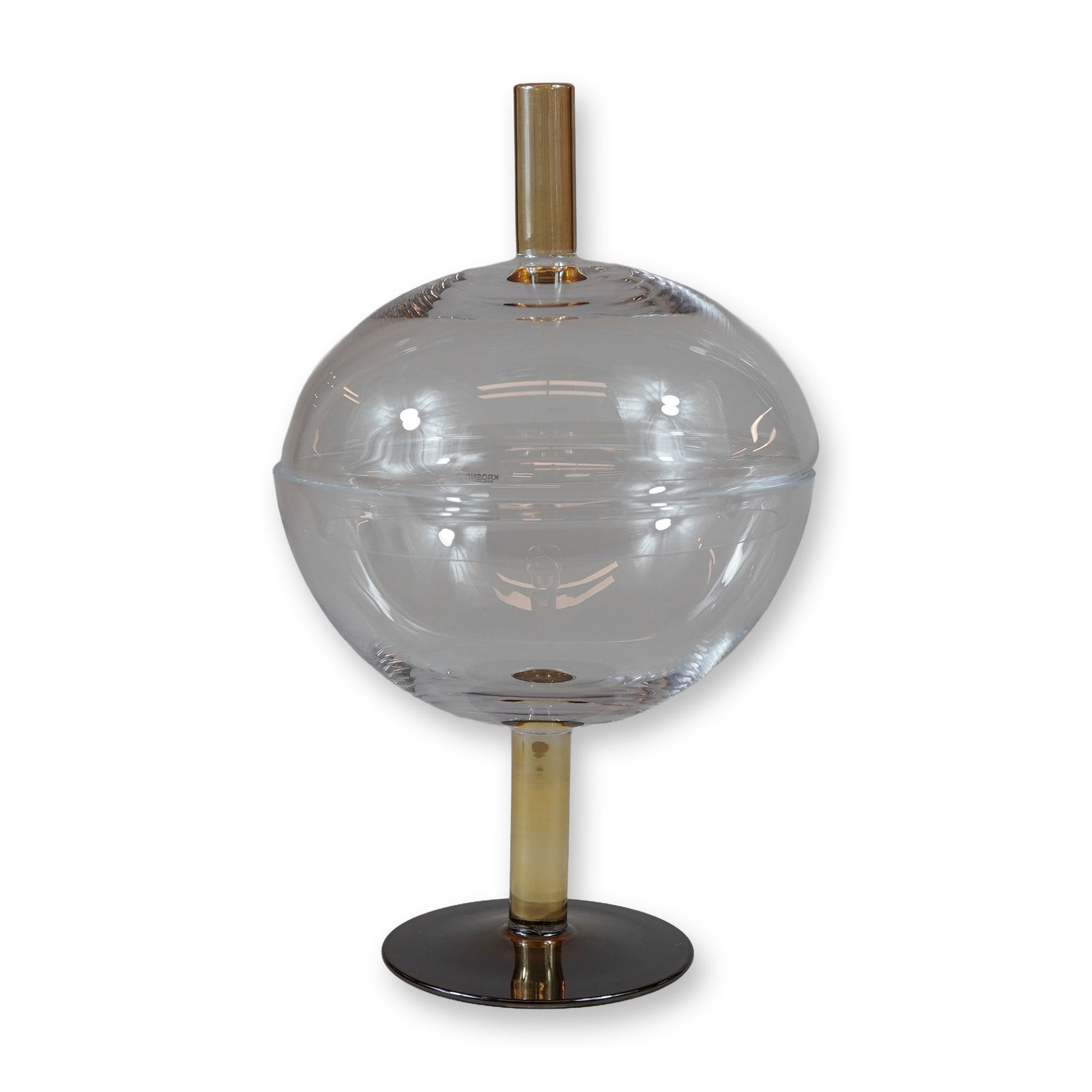 Krosno Poland Gianna Glass Lidded Pedestal Dish: Krosno Gianna collection glass dish with lid. This modernist centerpiece features a clear glass spherical form resting on an amber-toned cylindrical stem and a smoke-colored circular base. The matchin