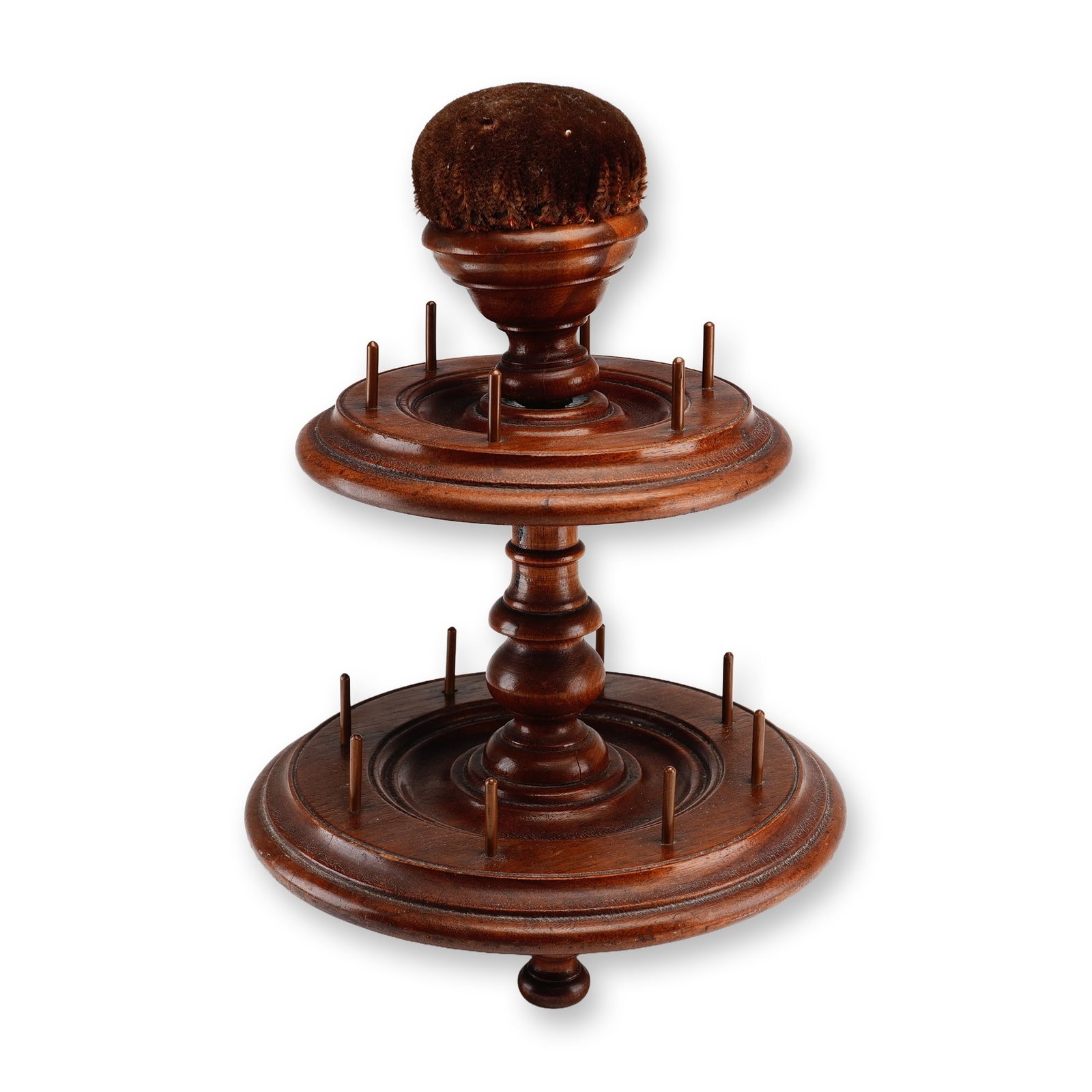 Victorian Two-Tier Turned Wood Bobbin and Spool Holder: This two-tiered wooden bobbin and spool holder is an antique sewing accessory designed as a thread carousel. It is constructed from a dark-stained hardwood and features a central turned pedestal colum