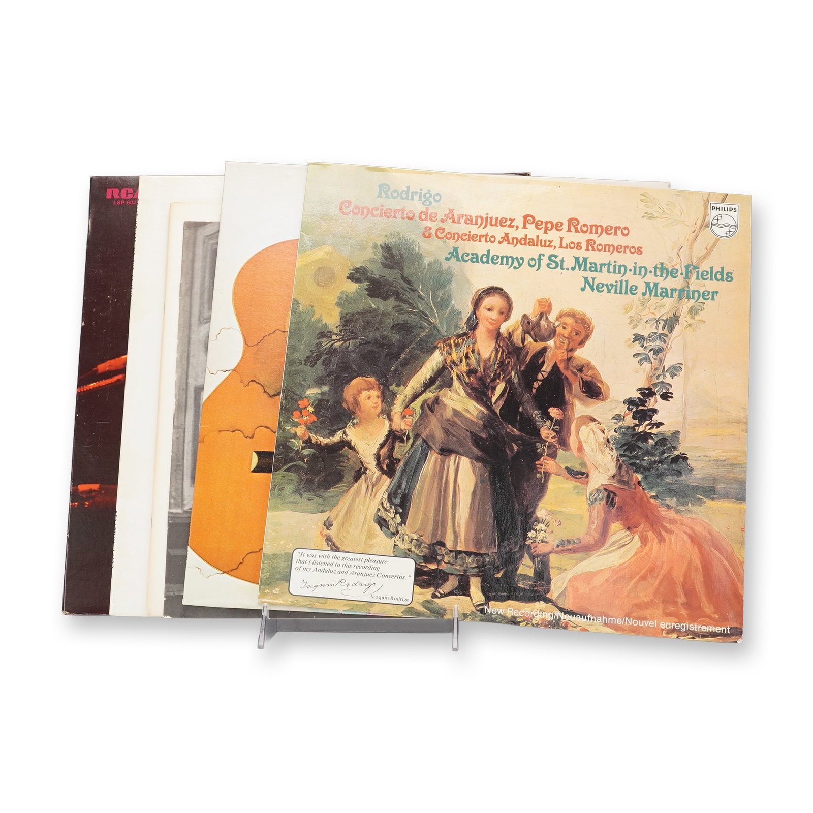 4pc Multi-Genre Vinyl Records: Vinyl records featuring notable performances and compositions across classical and popular genres. Included is a Philips recording of Rodrigo's "Concierto de Aranjuez" and "Concierto Andaluz,"