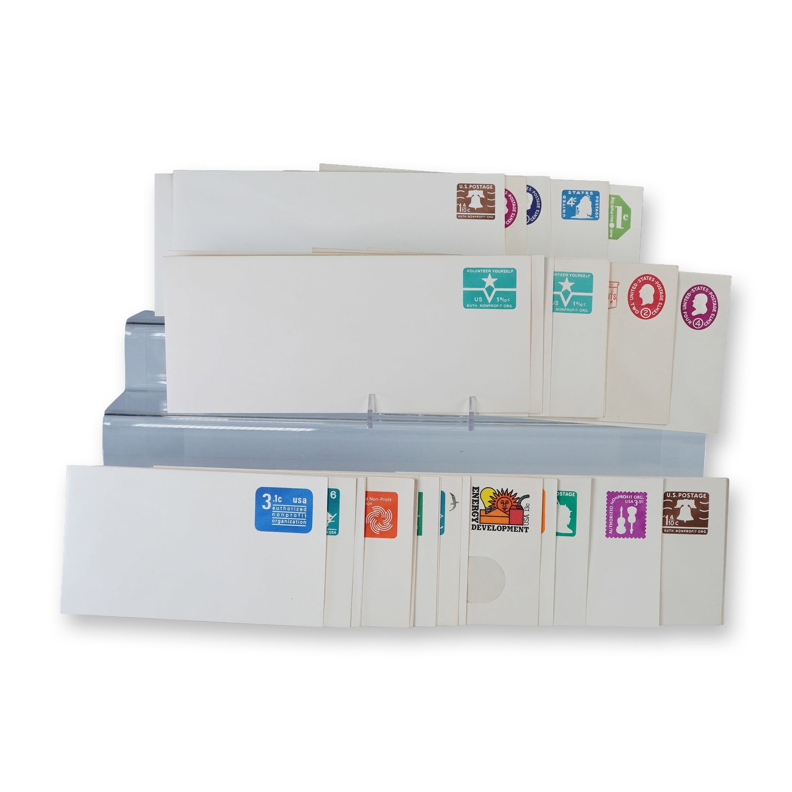 31pc Vintage US Postal Stationery Envelopes: Collection of thirty vintage United States postal stationery envelopes with pre-printed postage in assorted denominations and designs. Includes colorful examples featuring motifs such as the Liberty