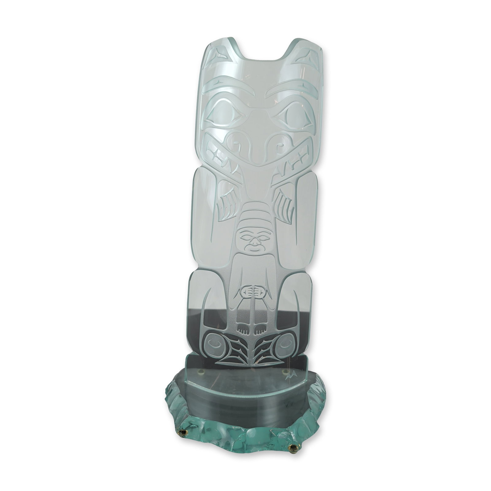 David Montpetit Northwest Coast Style Etched Glass Totem: David Montpetit (Canadian, b. 1951). Vertical totem sculpture in etched and sandblasted plate glass, featuring Northwest Coast Indigenous formline designs. The composition includes an upper zoomorphic