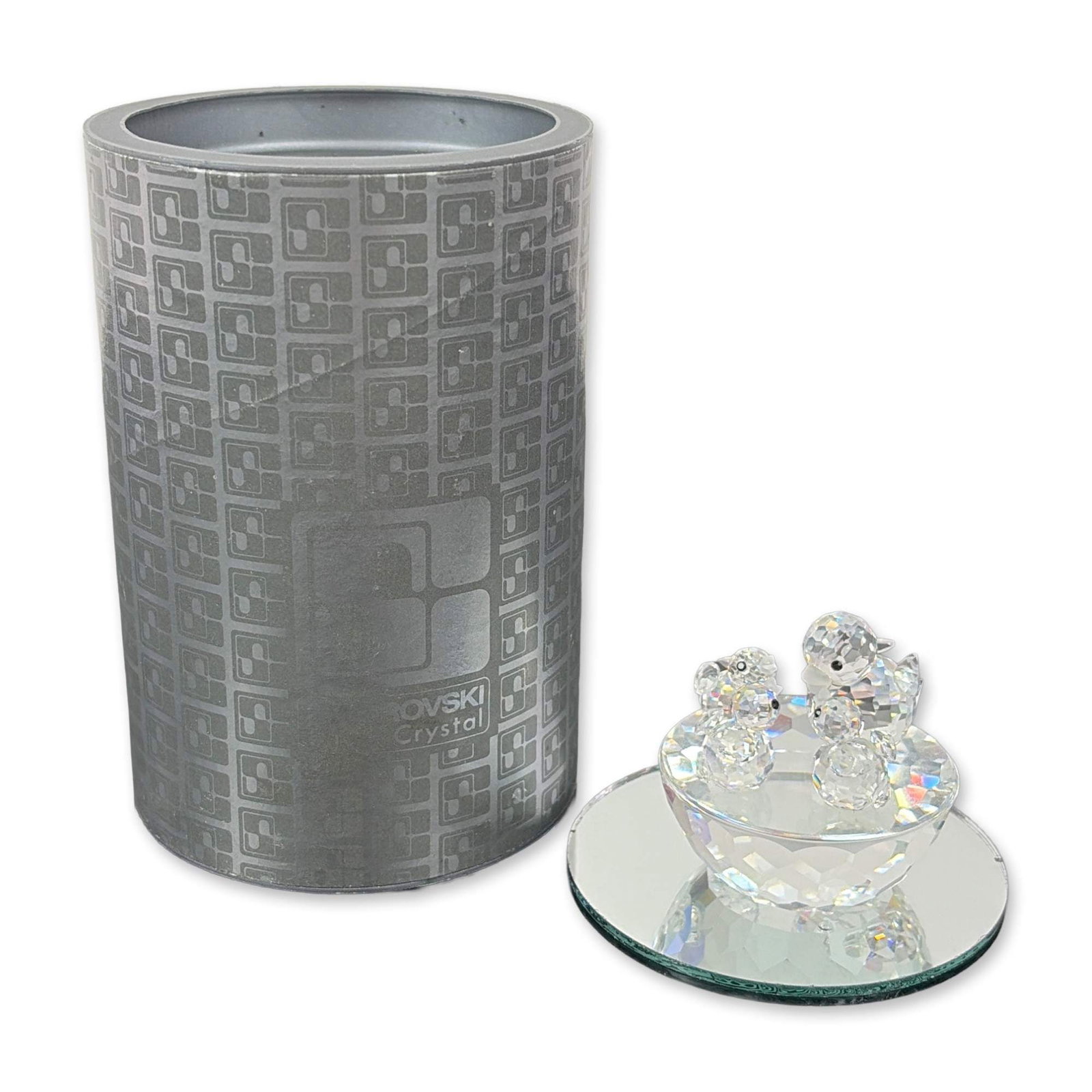 Swarovski Silver Crystal Birds' Nest Figurine: Article number 7470 NR 050 000, model 013842, is part of the Exquisite Accents series. It features a mother bird and three chicks sitting in their nest, with their posture suggesting feeding time. The
