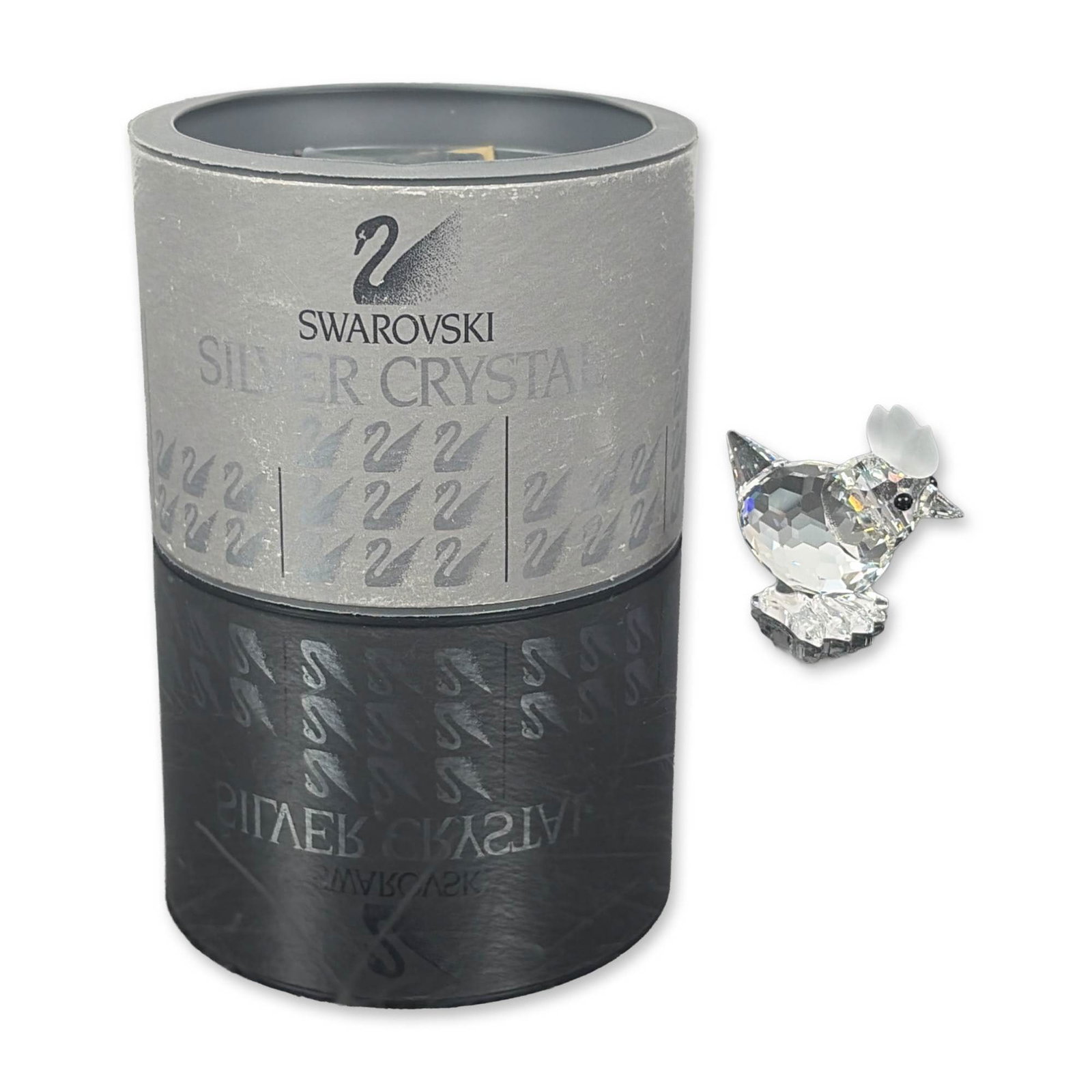 Swarovski Silver Crystal Mini Hen Figurine, Artist Signed: This Swarovski crystal mini hen, crafted primarily from clear faceted crystal, features striking black eyes and a charming, frosted comb. Part of the delightful Barnyard Friends theme group, its base 