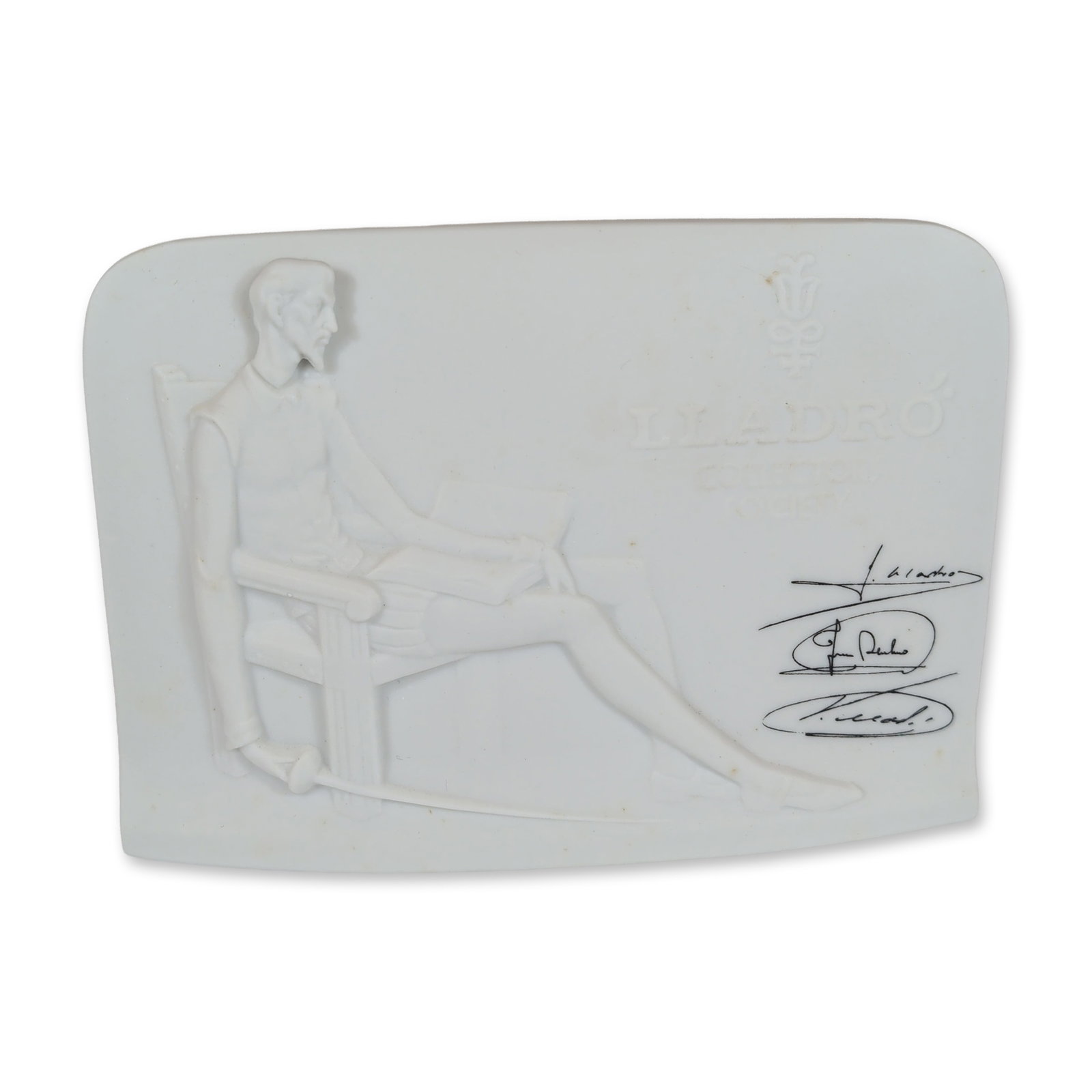 Lladro Porcelain Collector's Society Don Quixote Plaque: Lladro Collector's Society display plaque in white matte bisque porcelain, featuring a bas-relief depiction of Don Quixote seated with a book. The reverse side features a molded shell motif. The front