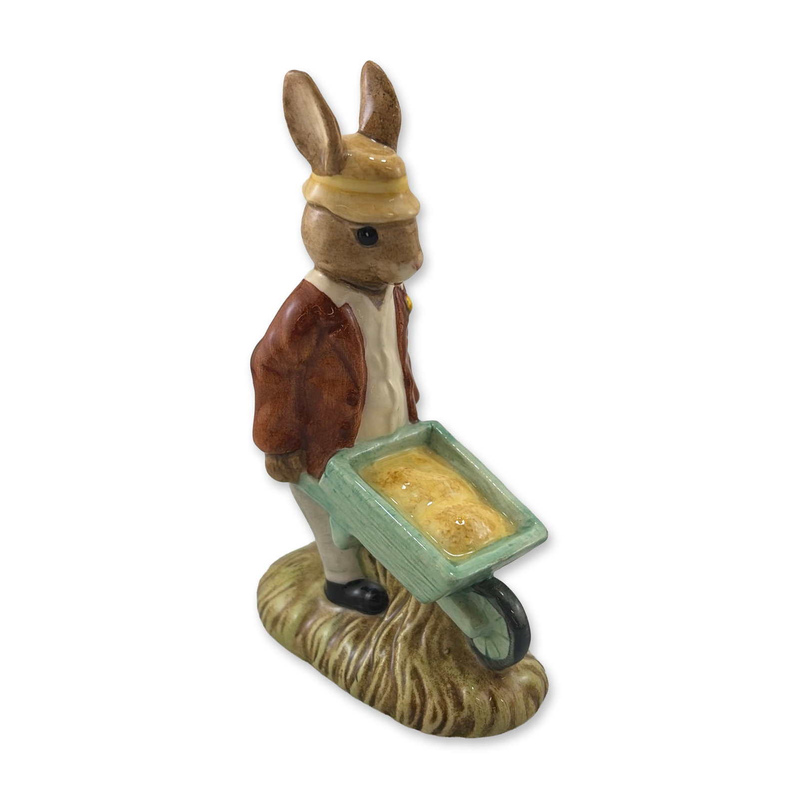 Royal Doulton Gardener Bunnykins Porcelain Figurine DB156: Royal Doulton hand-painted porcelain figurine from the Bunnykins series titled Gardener Bunnykins, model number DB 156. The piece features a rabbit character wearing a brown jacket, white vest, and ye