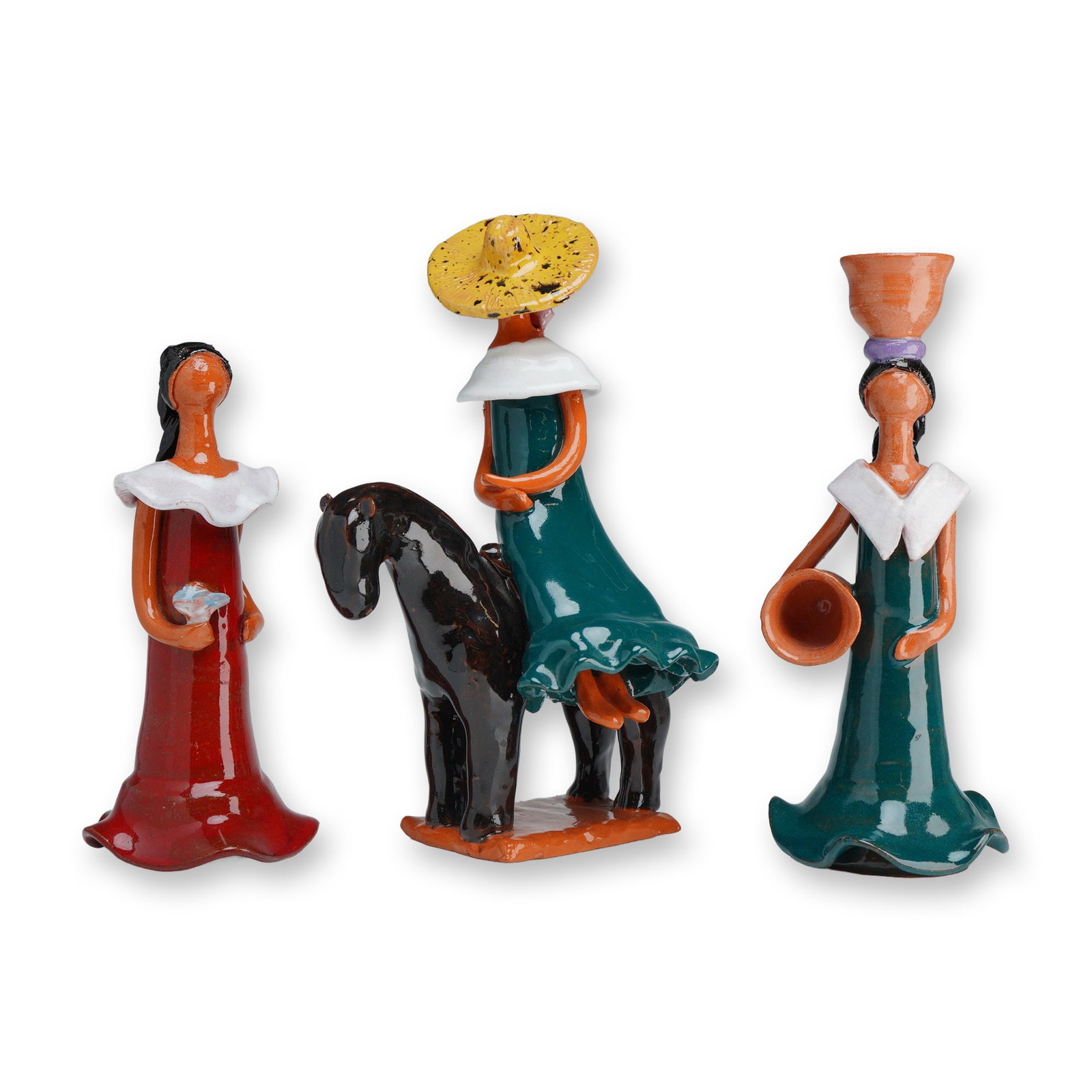 3pc Faceless Folk Art Terracotta Female Figurines: This 3pc terracotta figurines set is composed of hand-modeled clay with a high-gloss glaze. The group includes a standing figure in a red dress holding a bird, a figure in a green dress mounted on a d