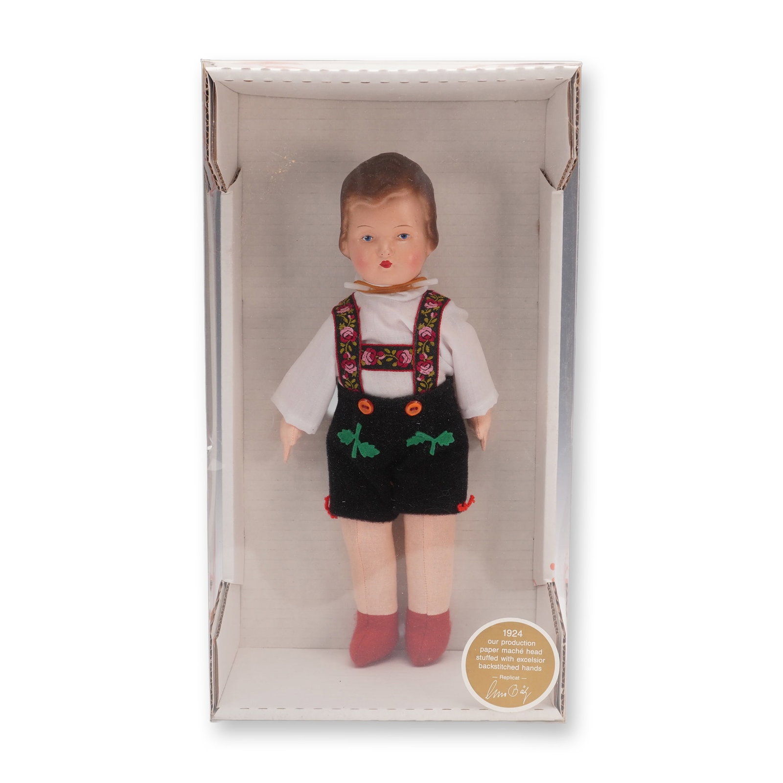 Lissi Dolls' Excelsior and Paper Mache Vintage Doll, Willie: This collector's piece features a hand-formed paper mache head, excelsior-stuffed body, and back stitched hands. The doll is dressed in traditional attire with embroidered suspenders, white shirt, bla