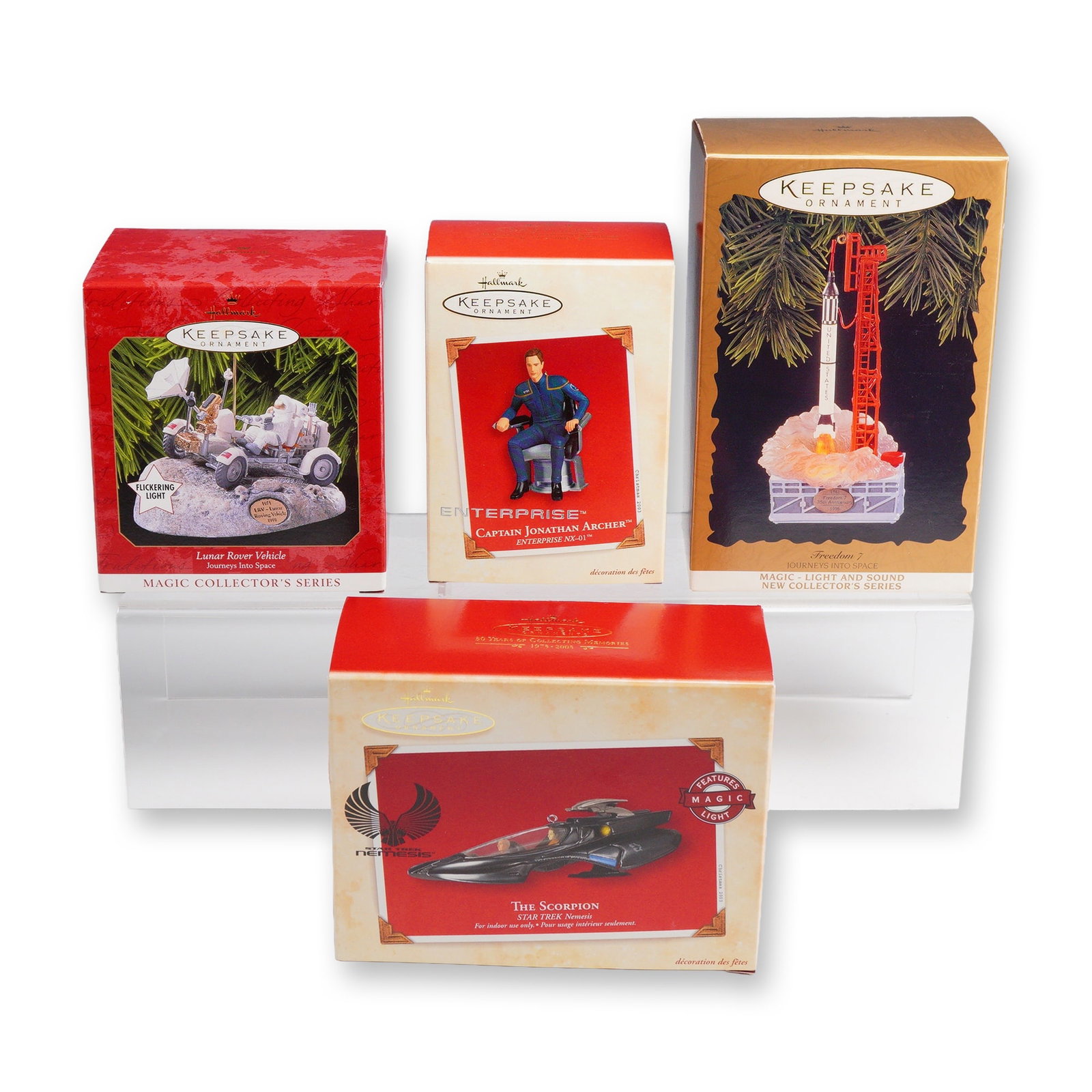 4pc Hallmark Keepsake Space Exploration and Star Trek Ornaments: This collection consists of four Hallmark Keepsake collectible ornaments, each housed in its original manufacturer packaging. The group includes two entries from the Journeys Into Space series and two