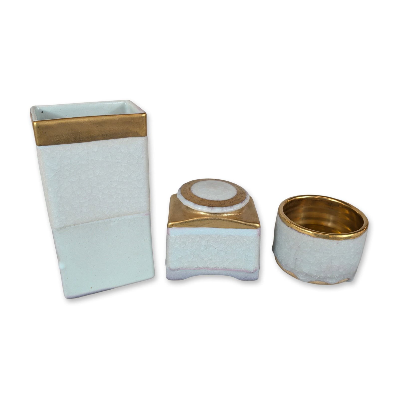 Trio of Contemporary Studio Ceramic Vessels with Gold Luster: Contemporary studio style. Trio of ceramic vessels with pale celadon crackle glaze and gold luster accents. The grouping includes a tall rectangular vase, a square lidded jar with an inset lid, and a