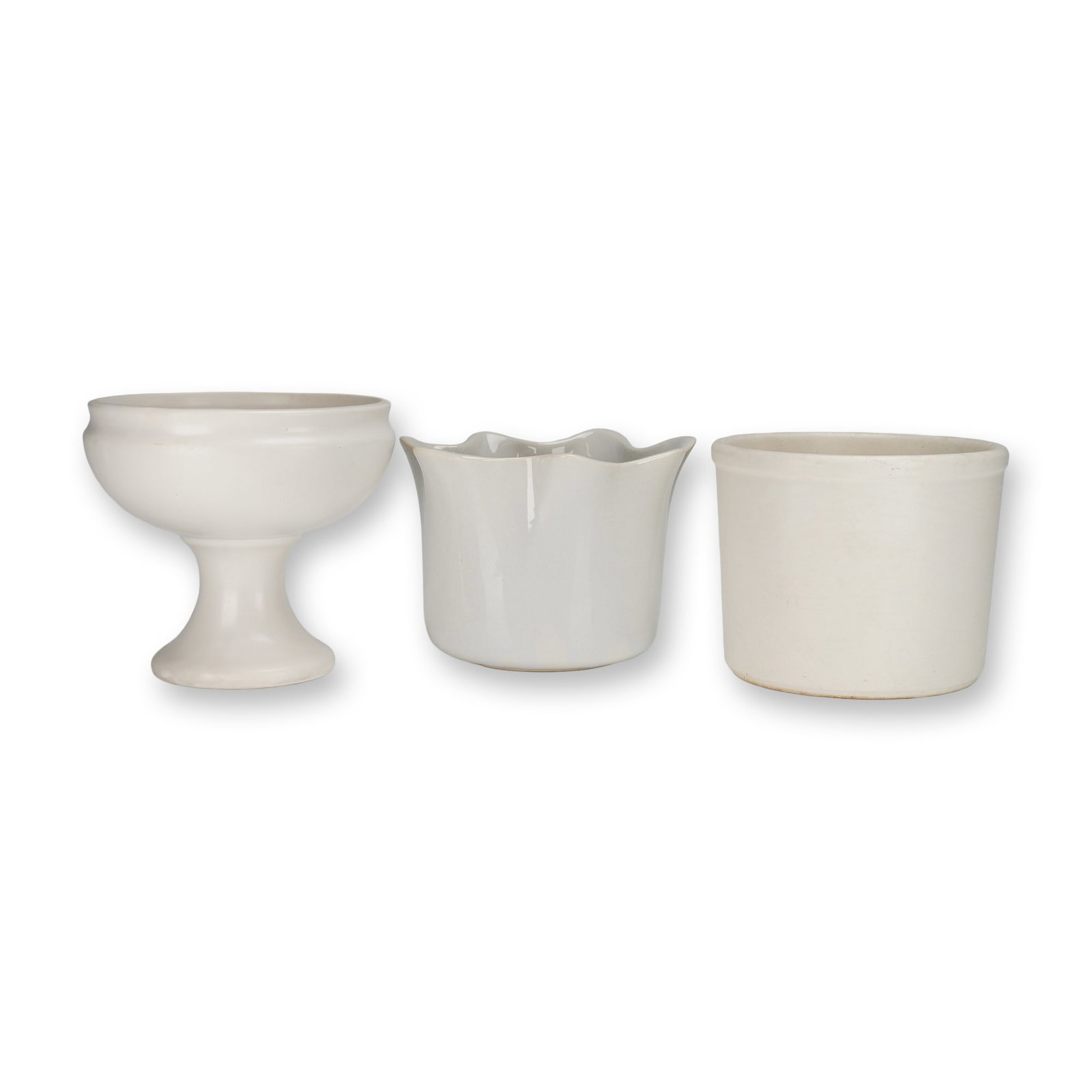 A Trio of McCoy Floraline White Ceramic Planters and Containers: A collection of three (3pc) white ceramic planters and storage containers from the McCoy Pottery Floraline design series. This group consists of three distinct forms, all finished in an off-white or