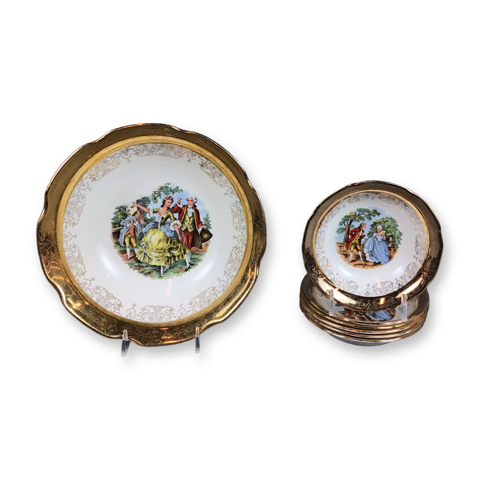 Seven Piece Sabin Crest-O-Gold Warranted 22 Karat Gold China Bowl Set: This set of Seven china bowls is produced by the Sabin China Company and features the Crest-O-Gold pattern. The collection consists of one large serving bowl and matching individual small bowls. Each