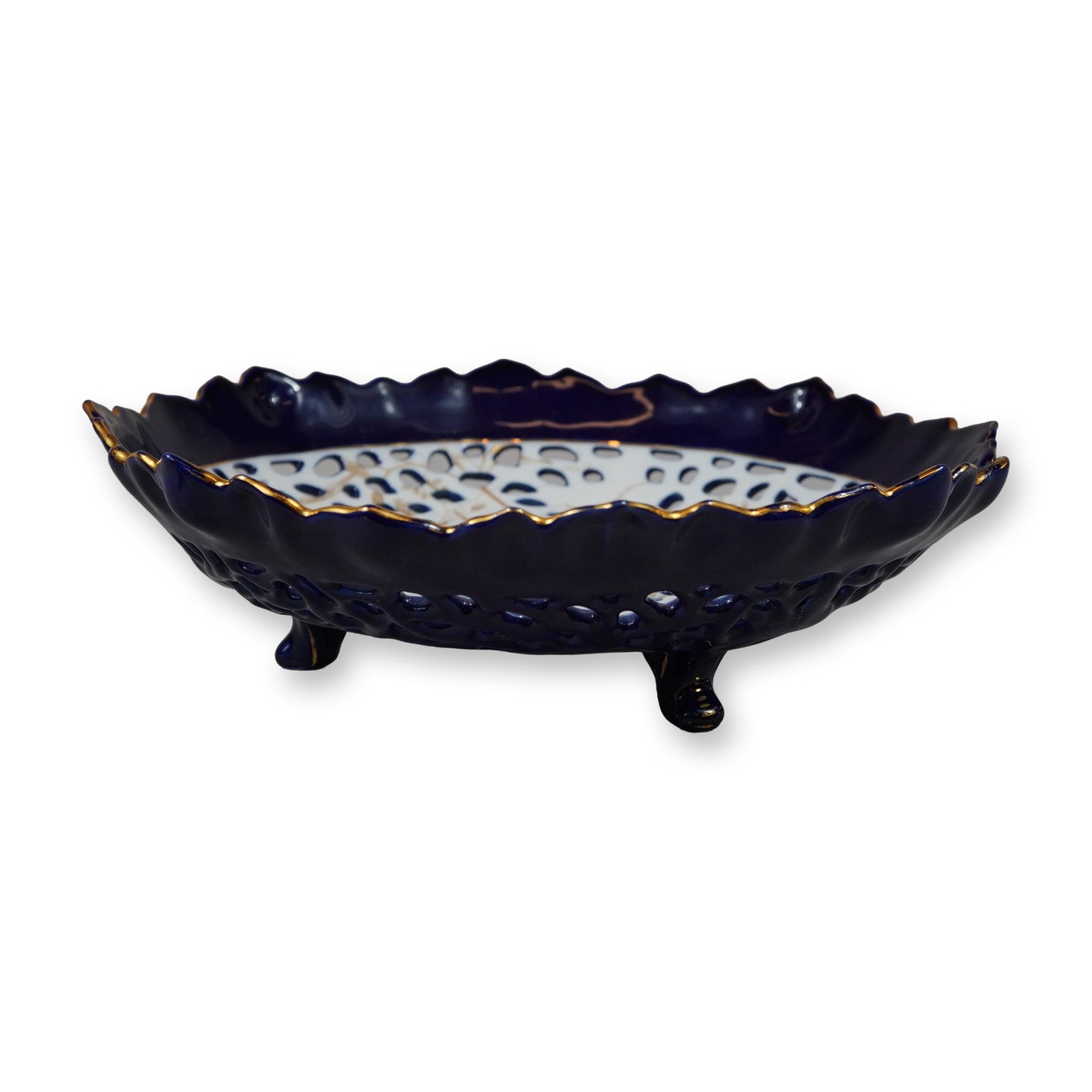 Gien Faience Vented Candy Dish with Blue White and Floral Accents: This shallow circular candy dish is attributed to the French manufacturer Gien and features a vented or reticulated design with blue, white, and floral accents. The piece is constructed with