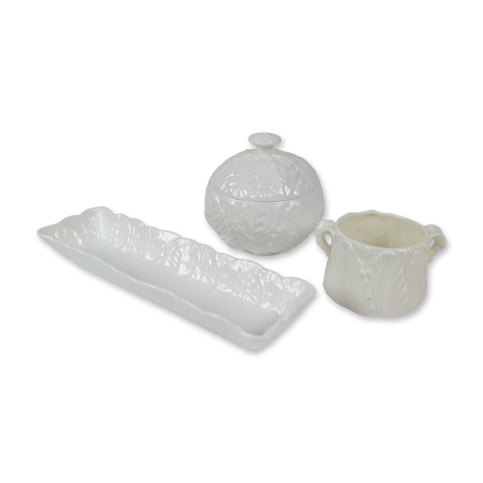 Three Coalport Country Ware and Royal Worcester Bone China: This charming set features an all-over embossed leaf design beneath a white glaze. It includes a Royal Worcester double-handled creamer or open sugar bowl, a Coalport lidded jam or sugar bowl with a