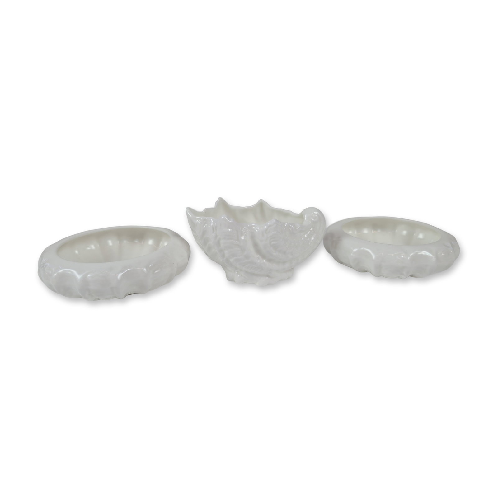 Three Coalport English Bone China Countryware: Featuring embossed leaf designs and a glossy white glaze. The assortment includes one shell-form bowl with a scrolling handle and two circular nut or salt dishes with scalloped rims. Each piece