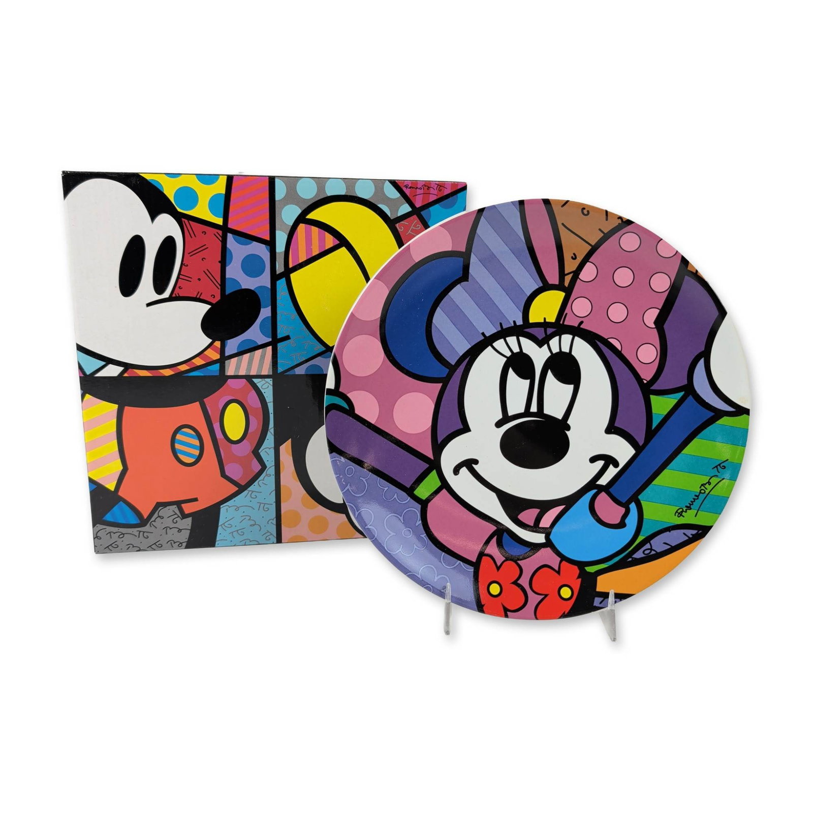 Disney by Britto Minnie Ceramic Plate: The plate showcases Minnie Mouse with her signature patterns of dots and stripes. On the front, it features a printed signature of Romero Britto, while the underside carries a Disney by Britto backsta