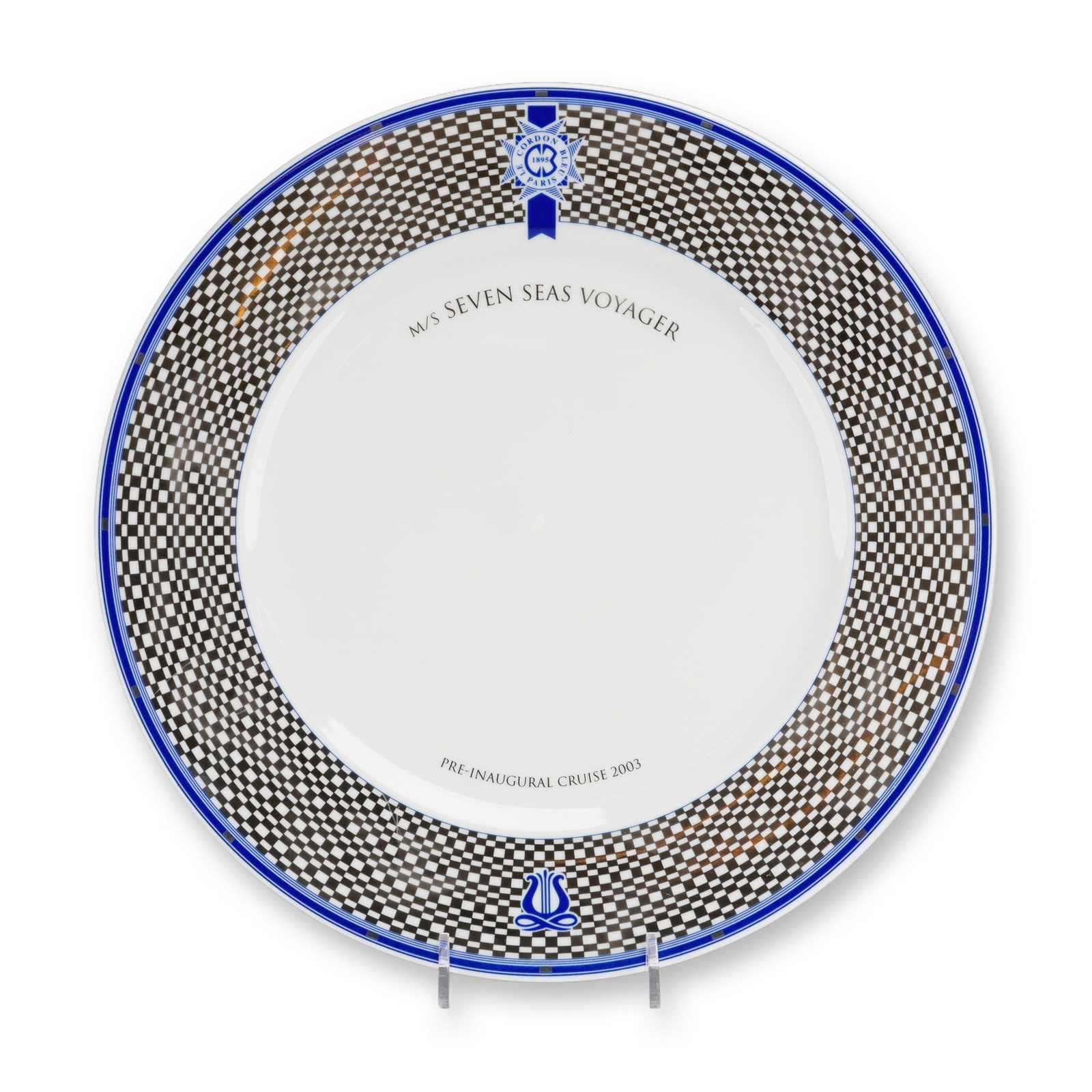 Porsgrund Norway Seven Seas Voyager Pre-Inaugural Cruise Cordon Bleu Plate: A Porsgrund Norway porcelain commemorative plate produced for the M/S Seven Seas Voyager Pre-Inaugural Cruise in 2003. The round plate features a wide border decorated with a brown and white checkered