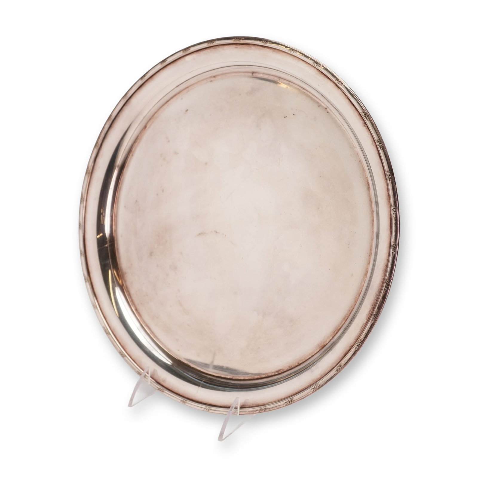 Elkington and Co. Silver Plate Round Serving Tray: This is a circular serving tray manufactured by Elkington and Co. of Birmingham, England. The piece is constructed from silver-plated metal, and user-provided specifications state it contains approxim