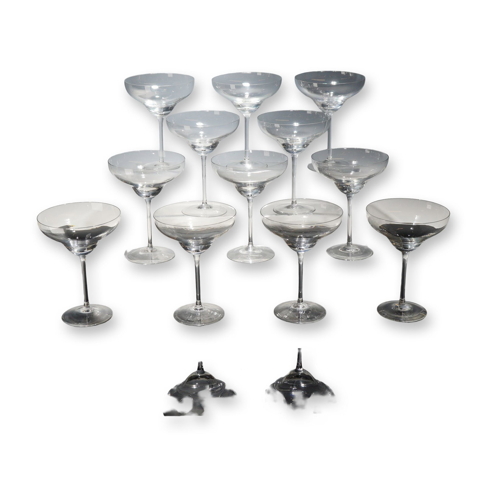 12pc Rosenthal Crystal Champagne Coupes, Romance II: Rosenthal set of 12 champagne coupes or cocktail glasses in clear blown crystal. Each glass features a wide, shallow, double-curved bowl with a stepped lower section, supported by a slender pulled