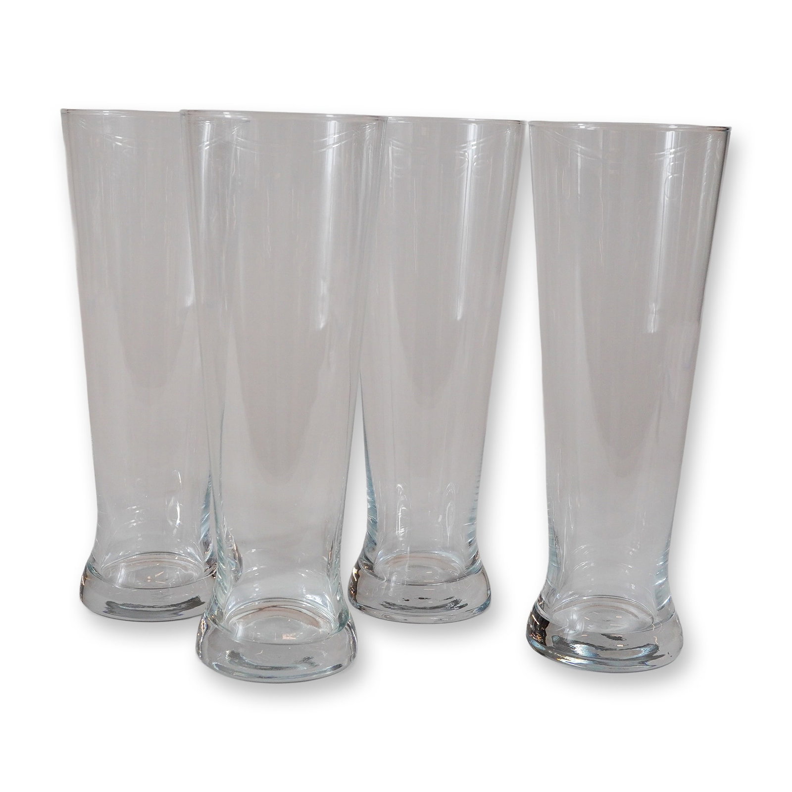 Set of Four Mikasa Glass Beer Glasses: A set of four clear glass beer glasses manufactured by Mikasa. Each glass is designed with a tall, slender body that tapers toward the base before expanding into a thick, weighted circular foot. The g