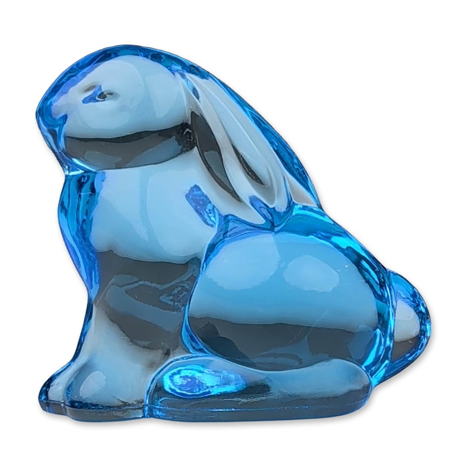Moser Blue Crystal Bunny Paperweight: A Moser paperweight depicting a seated bunny rabbit figurine in transparent sapphire blue crystal, featuring a minimalist, stylized form with smooth organic curves. The underside of the base bears an