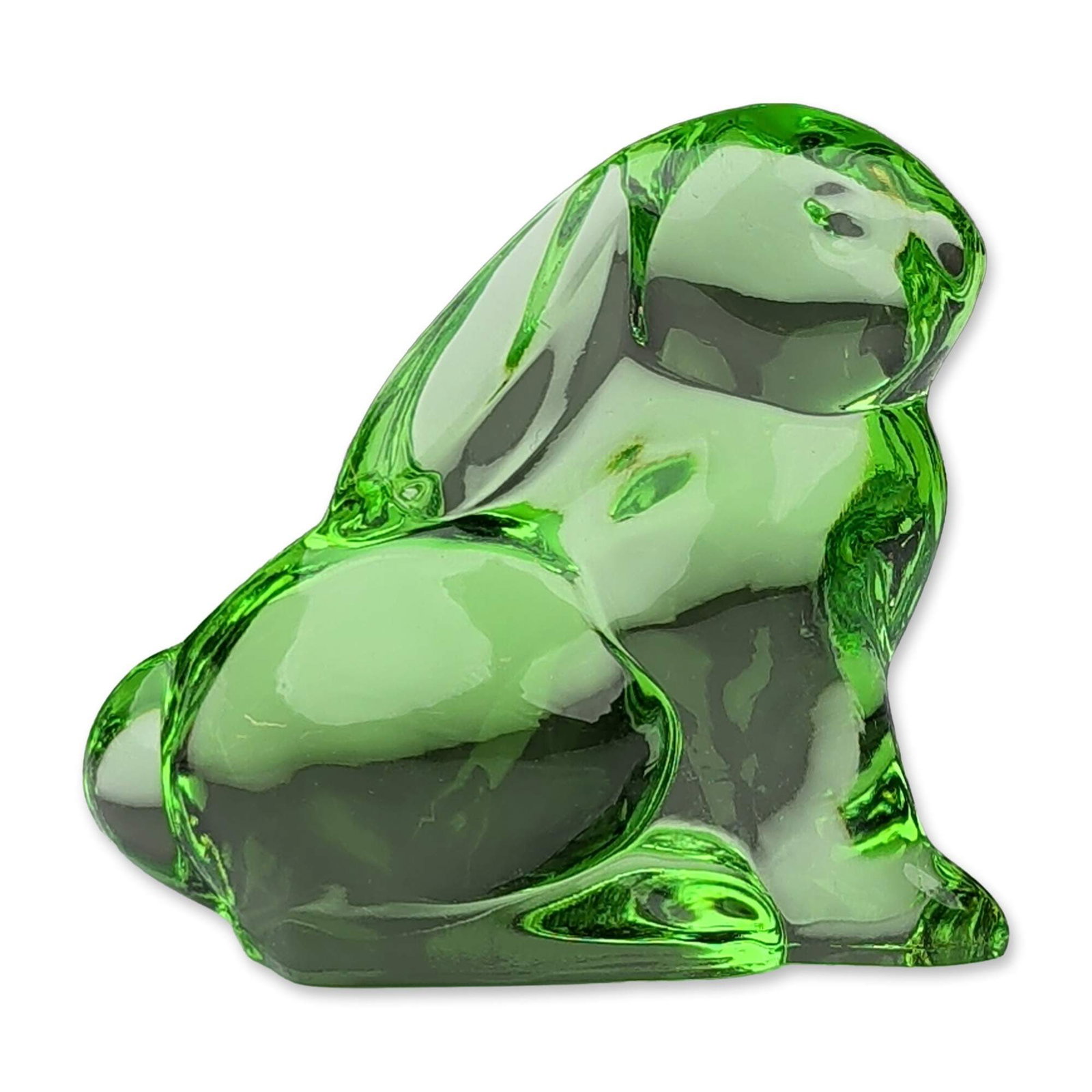 Moser Green Crystal Bunny Paperweight: A Moser paperweight depicting a seated bunny rabbit figurine in transparent emerald green crystal, featuring a minimalist, stylized form with smooth organic curves. The underside of the base bears an