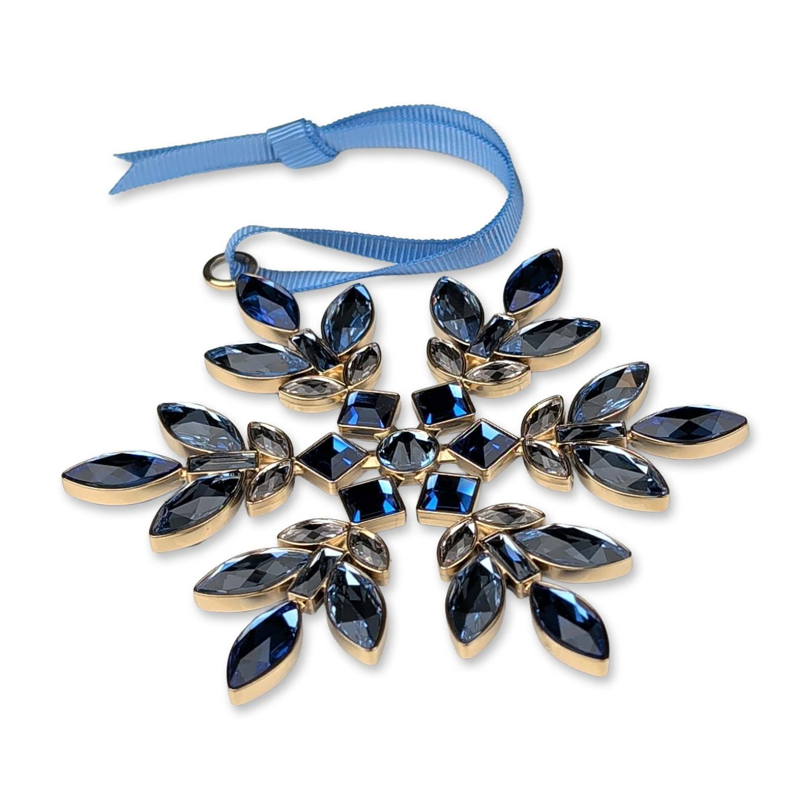 Swarovski Crystal Blue Gema Holiday Snowflake Ornament: A blue Swarovski Gema Holiday Ornament in gold-tone metal, featuring an array of marquise, square, and round-cut crystals in shades of dark blue, light blue, and clear, arranged in a six-pointed snowf