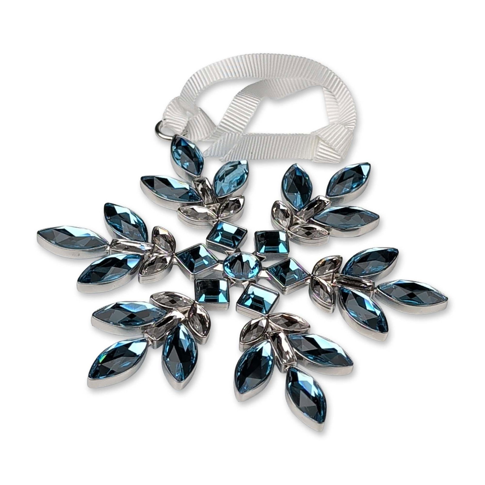 Swarovski NYC Limited Edition Light Blue Gema Holiday Snowflake Ornament: This Swarovski NYC Limited Edition Light Blue Gema Holiday Snowflake Ornament, model number 5681007, dazzles in the form of a six-pointed snowflake. This piece features sparkling multi-cut crystals in