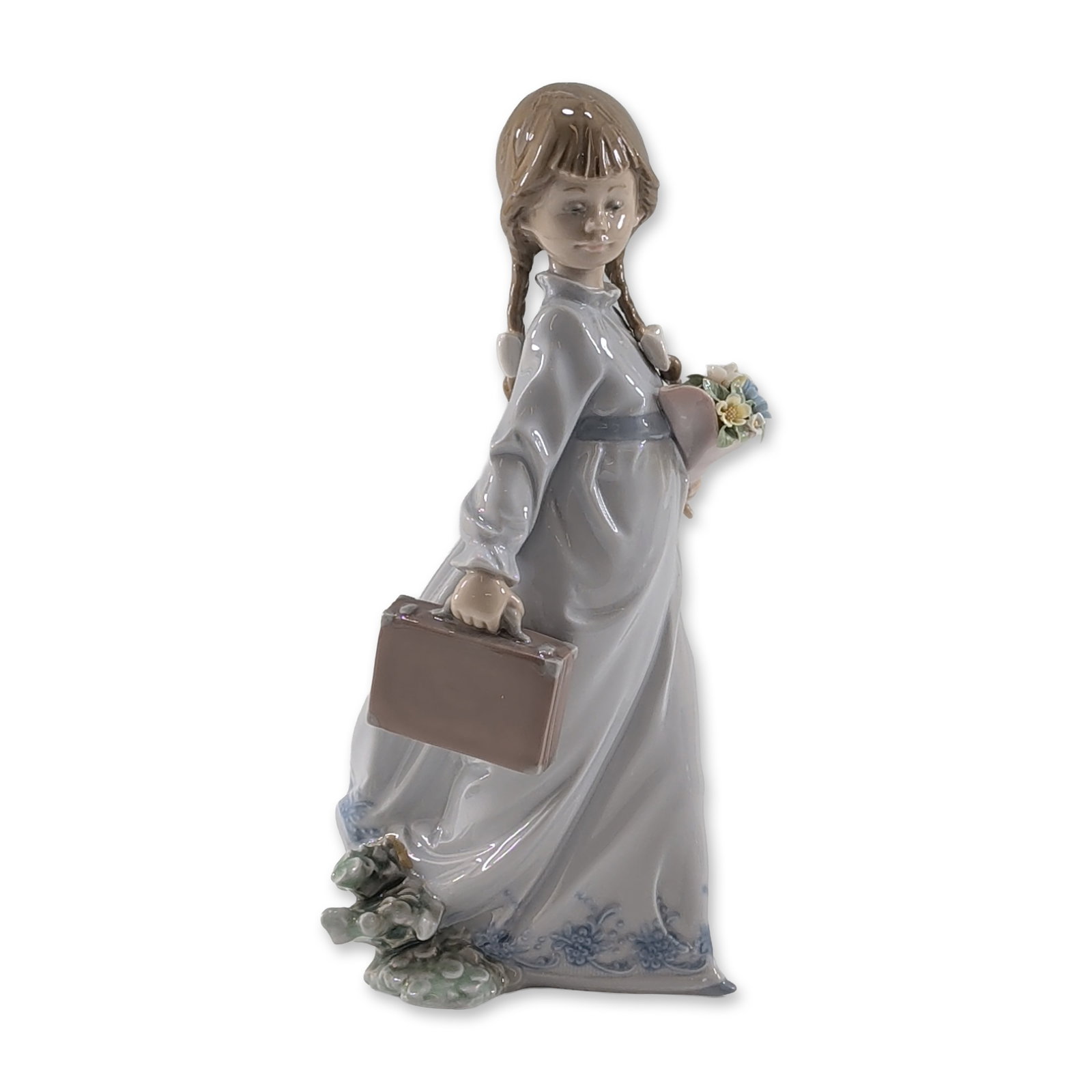 Lladro 1988 Collectors Society School Days Porcelain Figurine: Lladro (Spain). Glazed porcelain figurine titled School Days, model number 7604, sculpted by Antonio Ramos. The figure depicts a young girl with long brown braids dressed in a blue-gray floor-length g