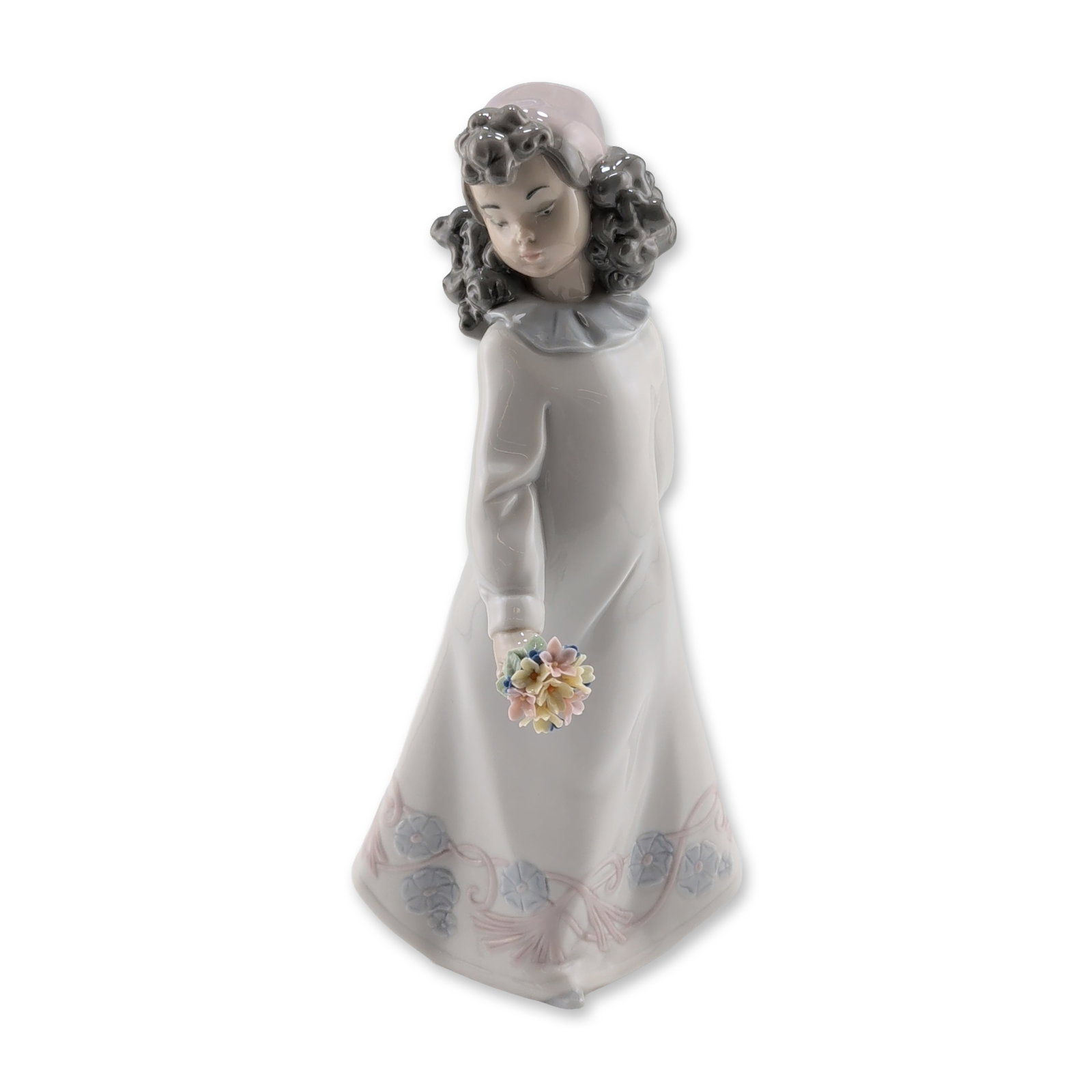 Lladro Pretty Posies Glazed Porcelain Figurine: Lladro Spanish glazed porcelain figurine titled Pretty Posies, model number 6551, sculpted by Joan Coderch. The piece depicts a young girl with dark curly hair and a pale pink bonnet wearing a full-le
