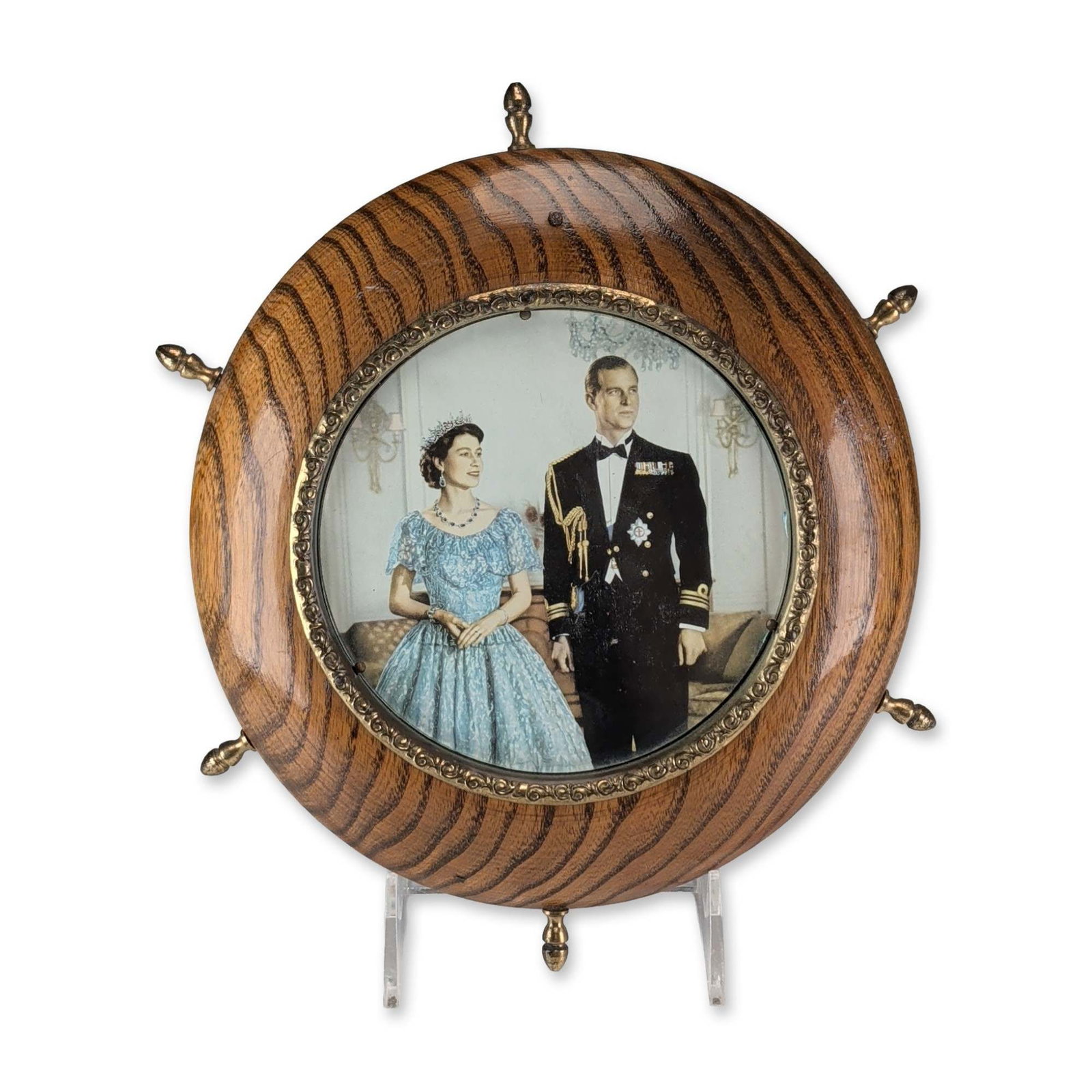 British Royal Commemorative Ship Wheel Wood Frame: Mid-20th century British Royal commemorative circular wood frame or plaque, designed in the form of a ship's wheel. The piece features a central portrait under glass depicting Queen Elizabeth II and P