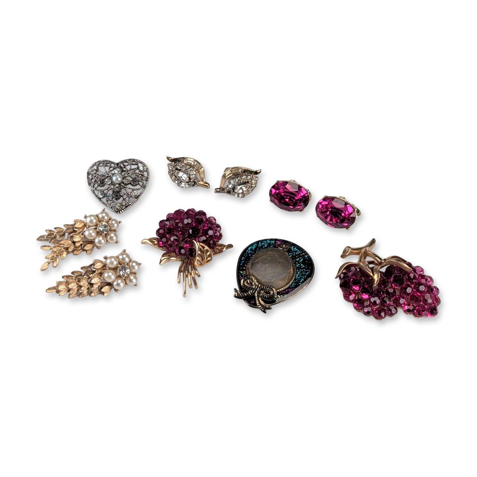 10pc Mid-Century Rhinestone Costume Earrings and Brooches: An assortment of costume jewelry in gold-tone and silver-tone base metals, featuring faceted glass beads, rhinestones, and faux pearls. The collection includes a Crown Trifari grape cluster brooch set