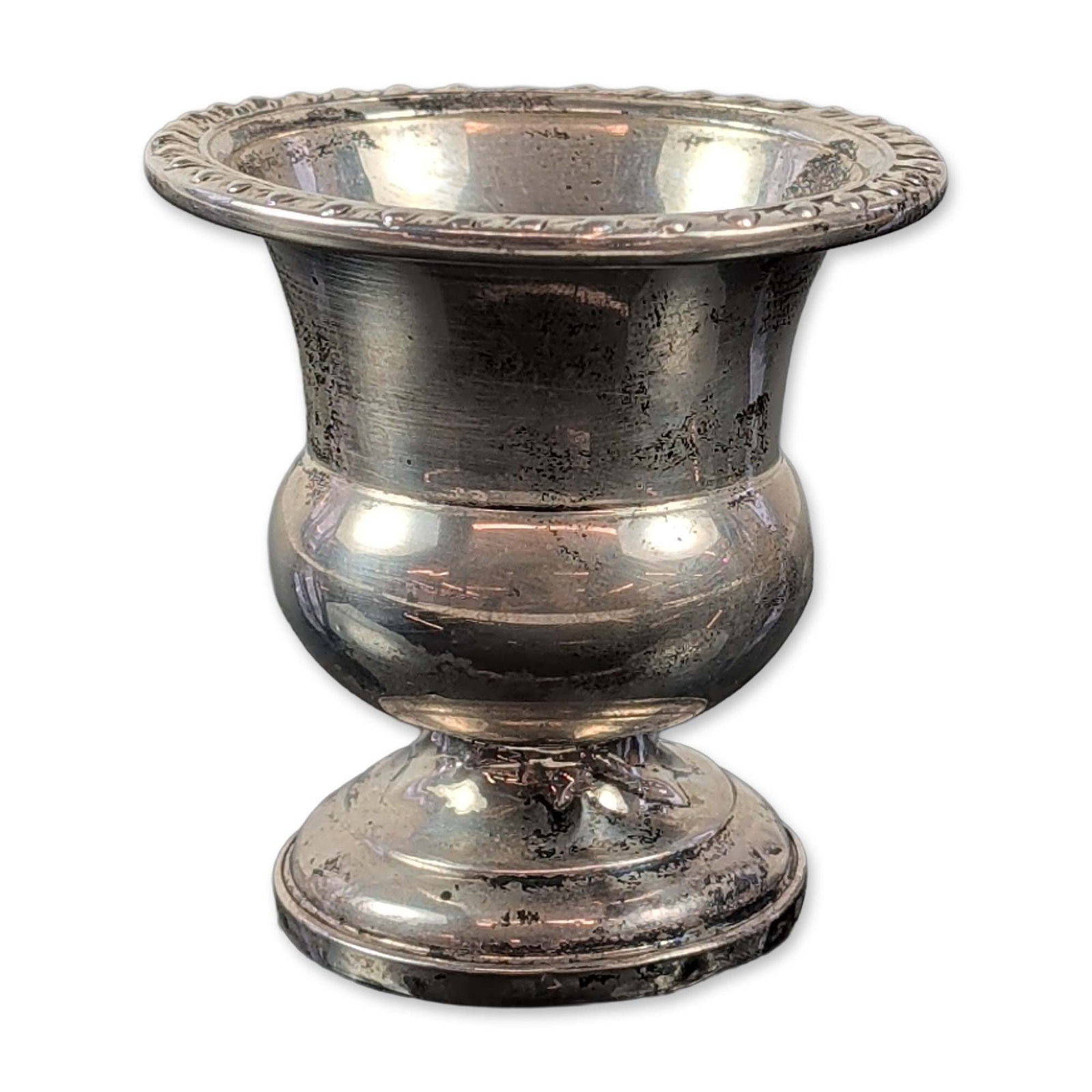 Revere Silver Smiths Weighted Sterling Silver Toothpick Holder: This American traditional-style toothpick holder is crafted in weighted sterling silver, with a flared gadrooned rim and a rounded body set on a pedestal base. It has a sterling silver exterior over