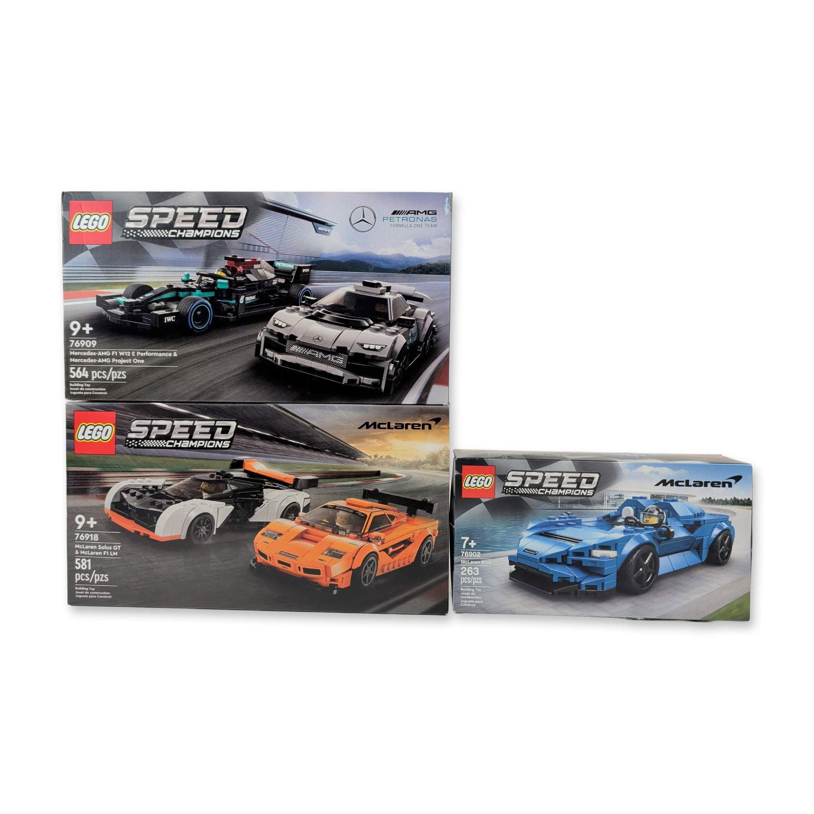 Three LEGO Speed Champions Factory Sealed Racing Sets: LEGO Group. Three factory sealed building sets from the Speed Champions series, featuring licensed automotive models. The group includes set 76909 with the Mercedes-AMG F1 W12 E Performance and