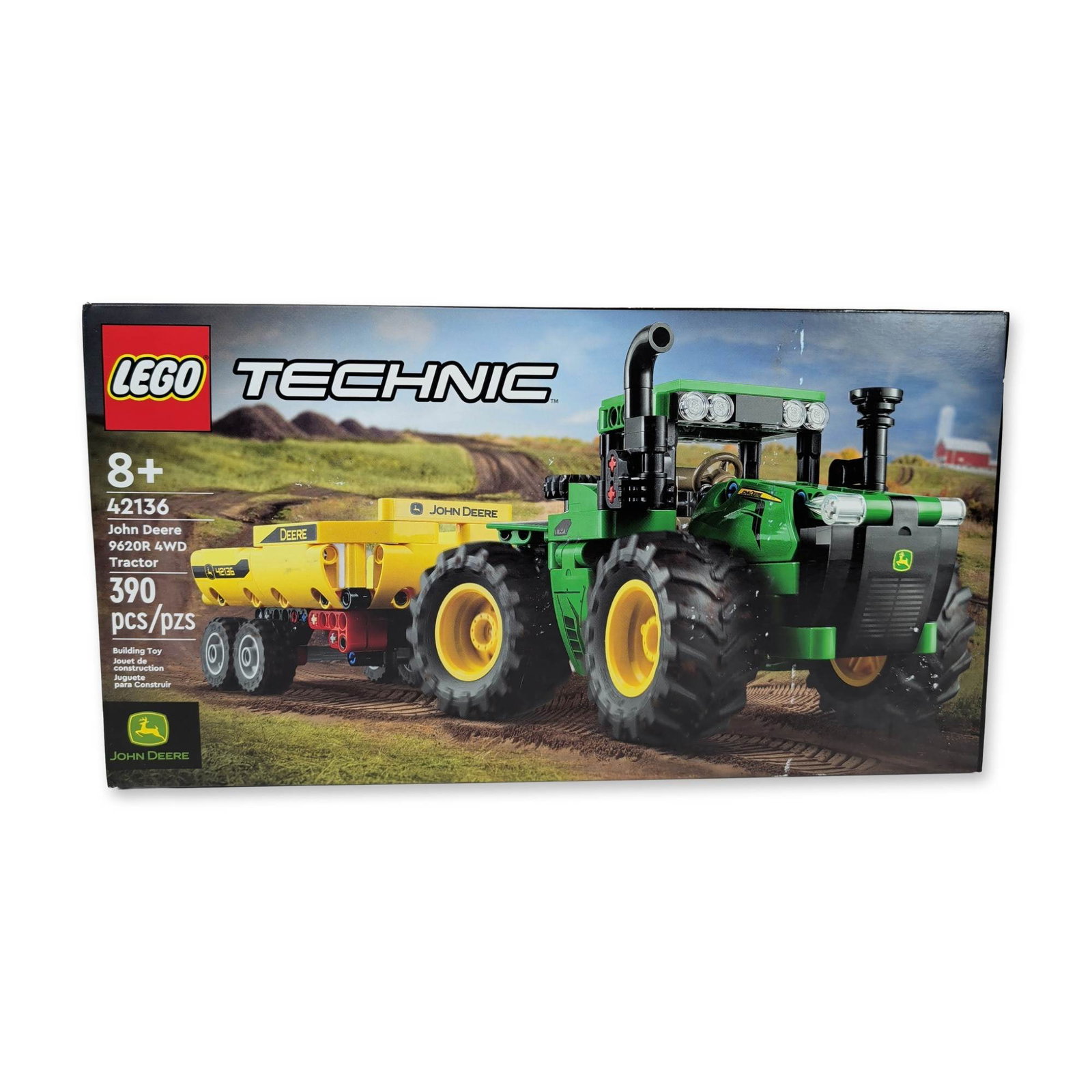 LEGO Technic John Deere 9620R Tractor: LEGO Technic John Deere 9620R 4WD Tractor building set, reference 42136. Plastic construction model featuring articulated steering and a detachable tipping trailer with steerable wheels. Set consists 