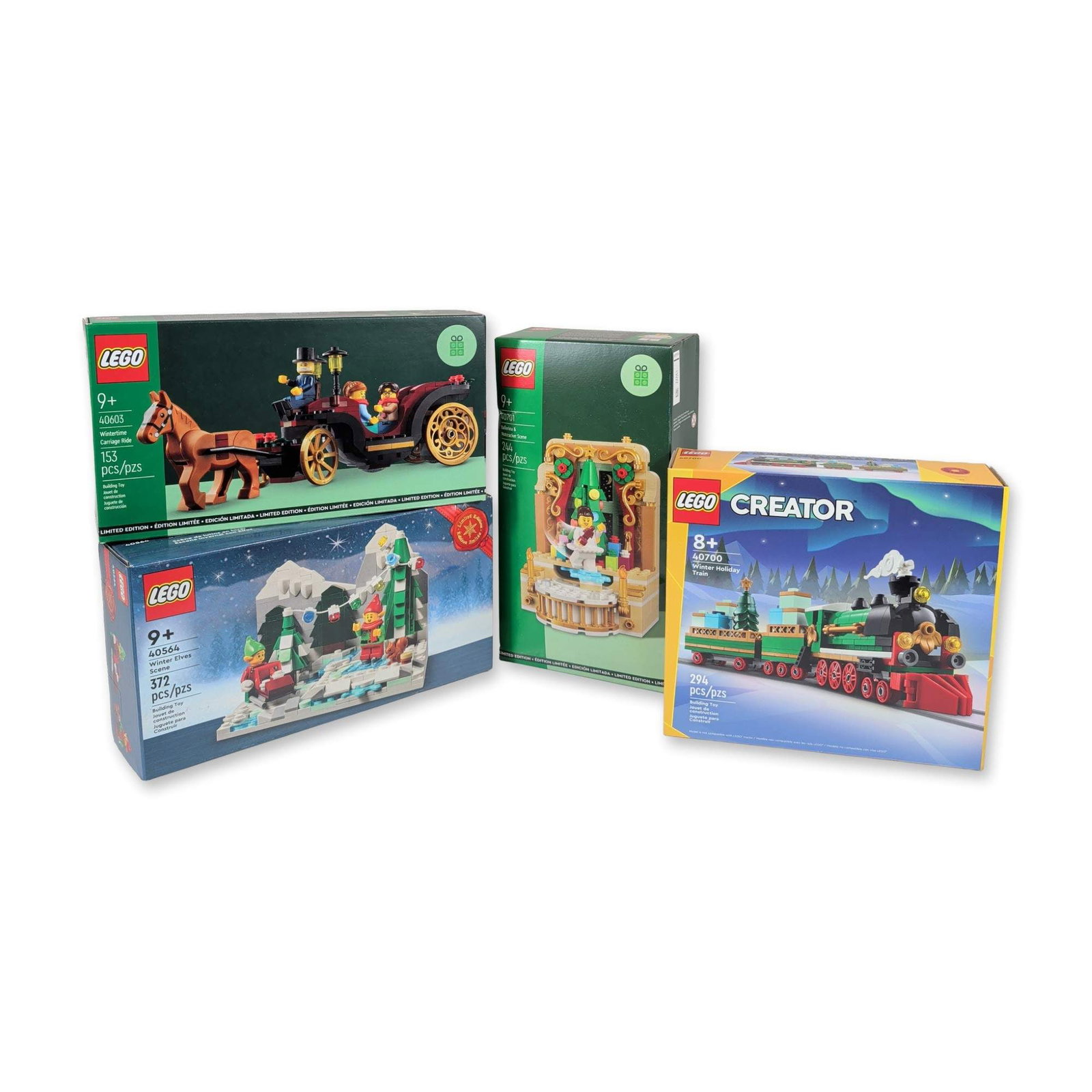 Group of Four LEGO Holiday Building Sets: LEGO Group. Group of four plastic construction building sets in a winter holiday theme. Includes set 40700 Winter Holiday Train, set 40701 Ballerina and Nutcracker Scene, set 40603 Wintertime Carriage