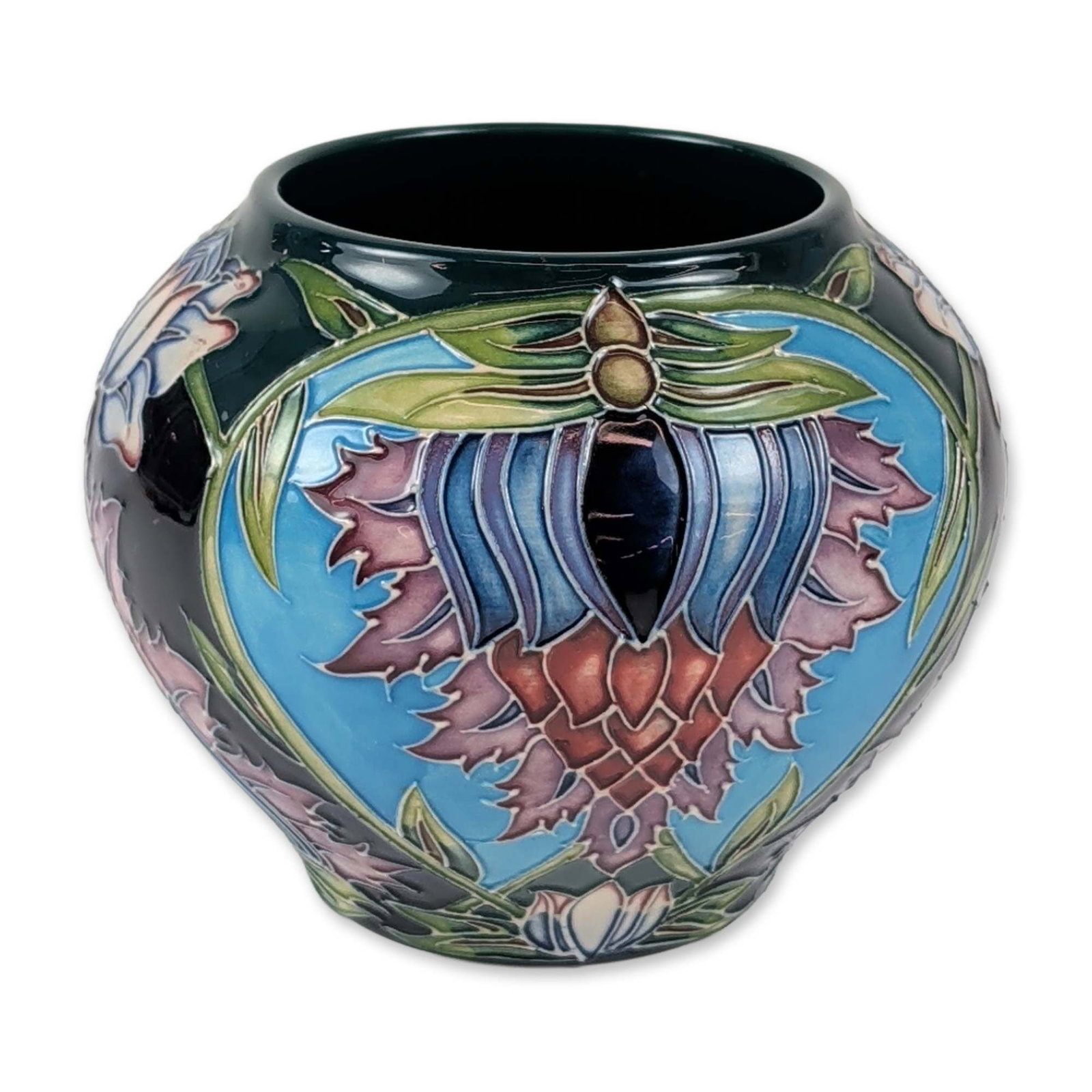 Moorcroft Saadian Pattern Earthenware Vase, 2001: Moorcroft pottery vase in the Saadian pattern, designed by Shirley Hayes. This squat bulbous earthenware vessel features stylized floral and foliate motifs rendered in the traditional tubelined